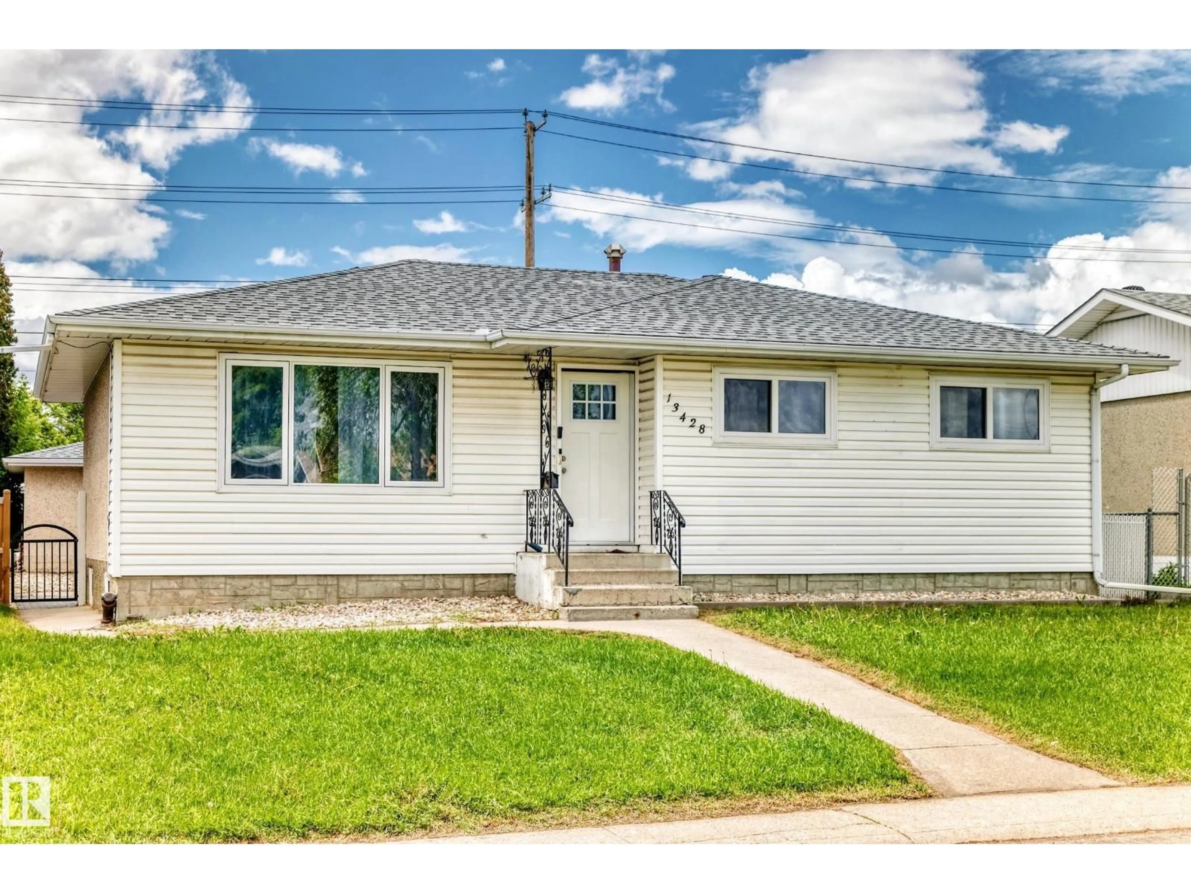 Home with vinyl exterior material, street for NW - 13428 82 ST, Edmonton Alberta T5E2V2