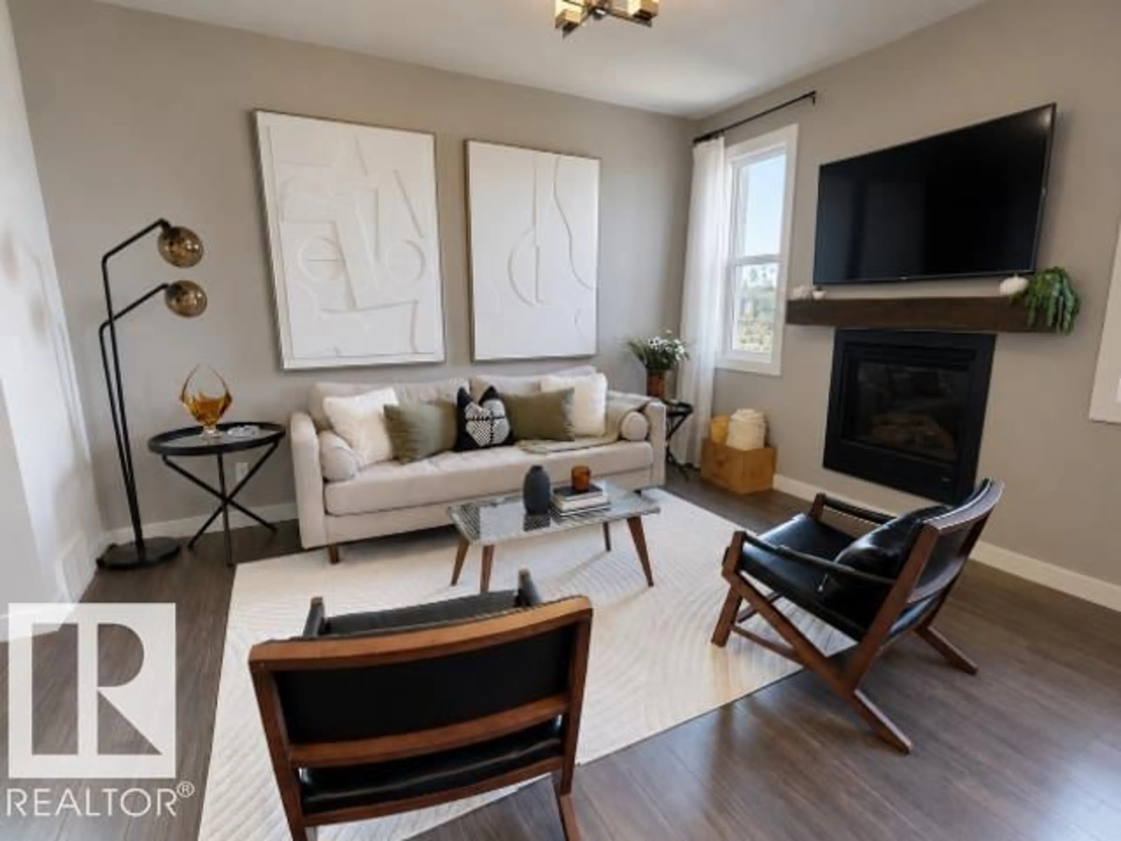 Living room with furniture, wood/laminate floor for 70 HAZELWOOD LN, Spruce Grove Alberta T7X0R7