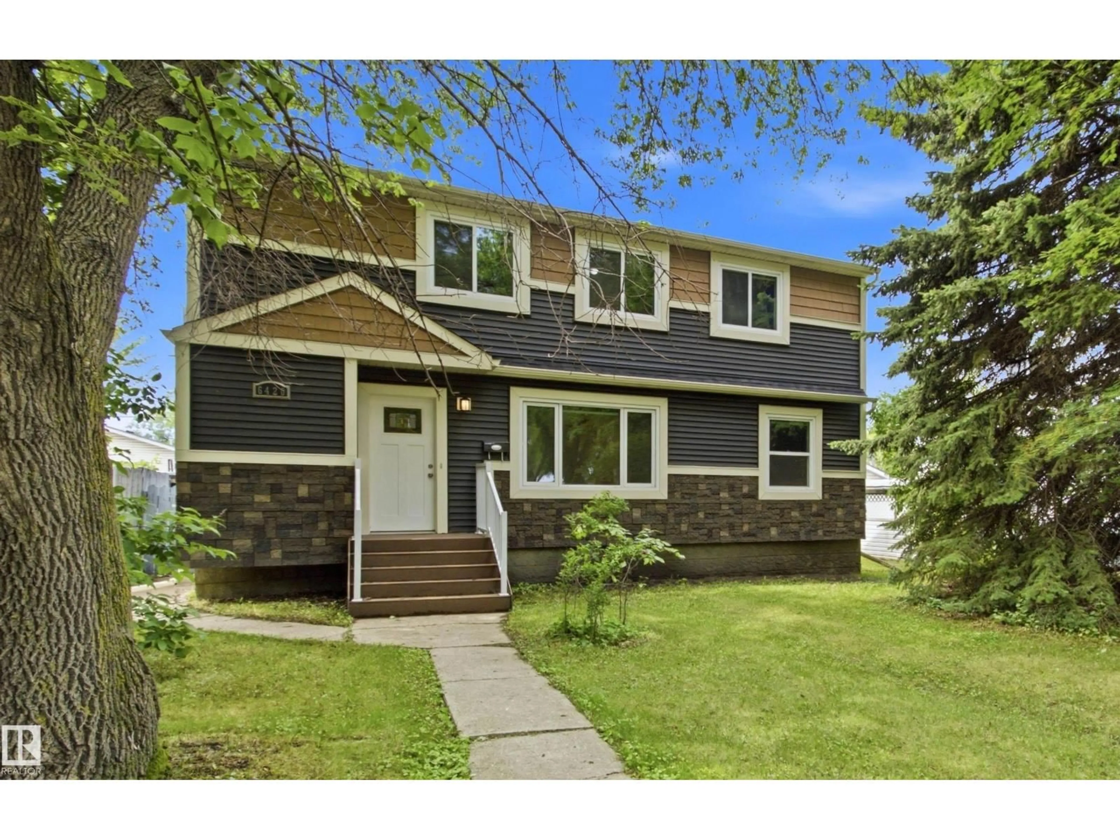Home with vinyl exterior material, street for 6420 105 ST, Edmonton Alberta T6H2N7