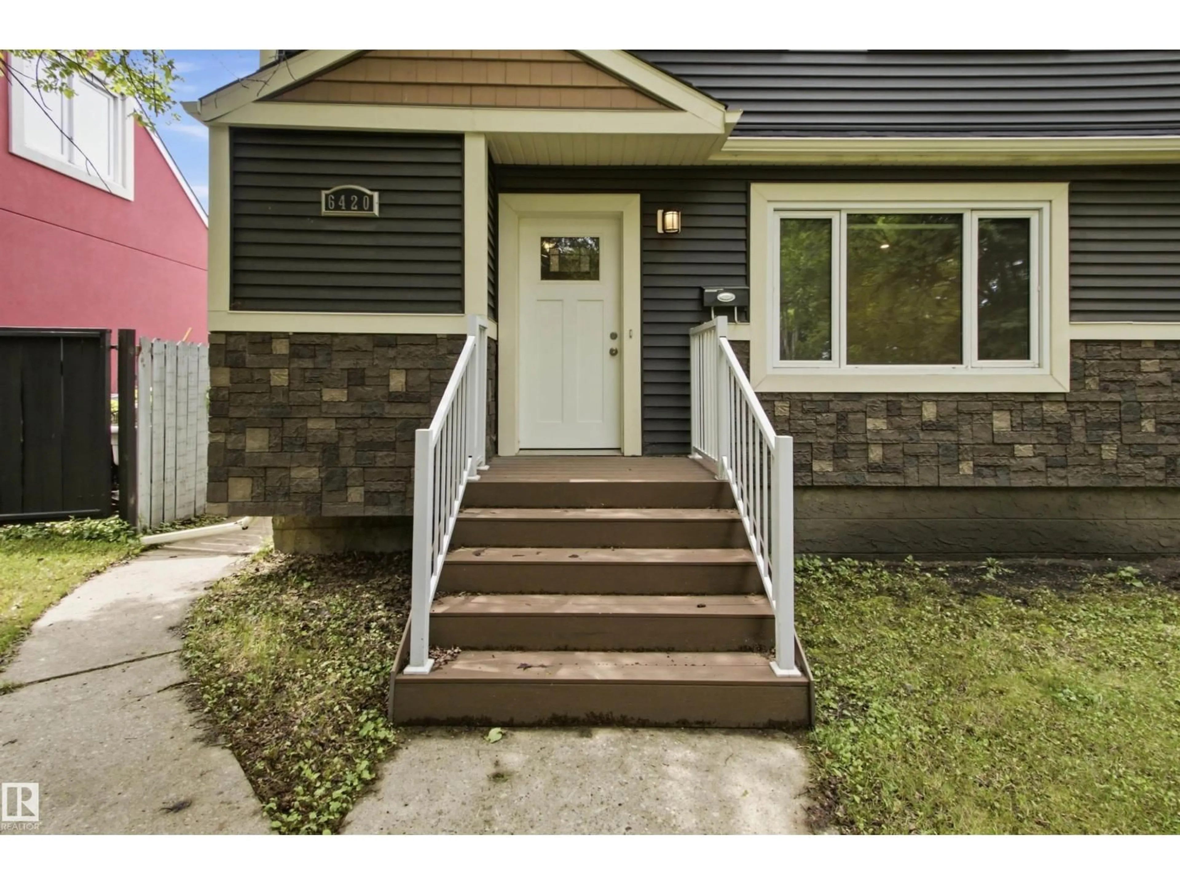 Home with vinyl exterior material, street for 6420 105 ST, Edmonton Alberta T6H2N7