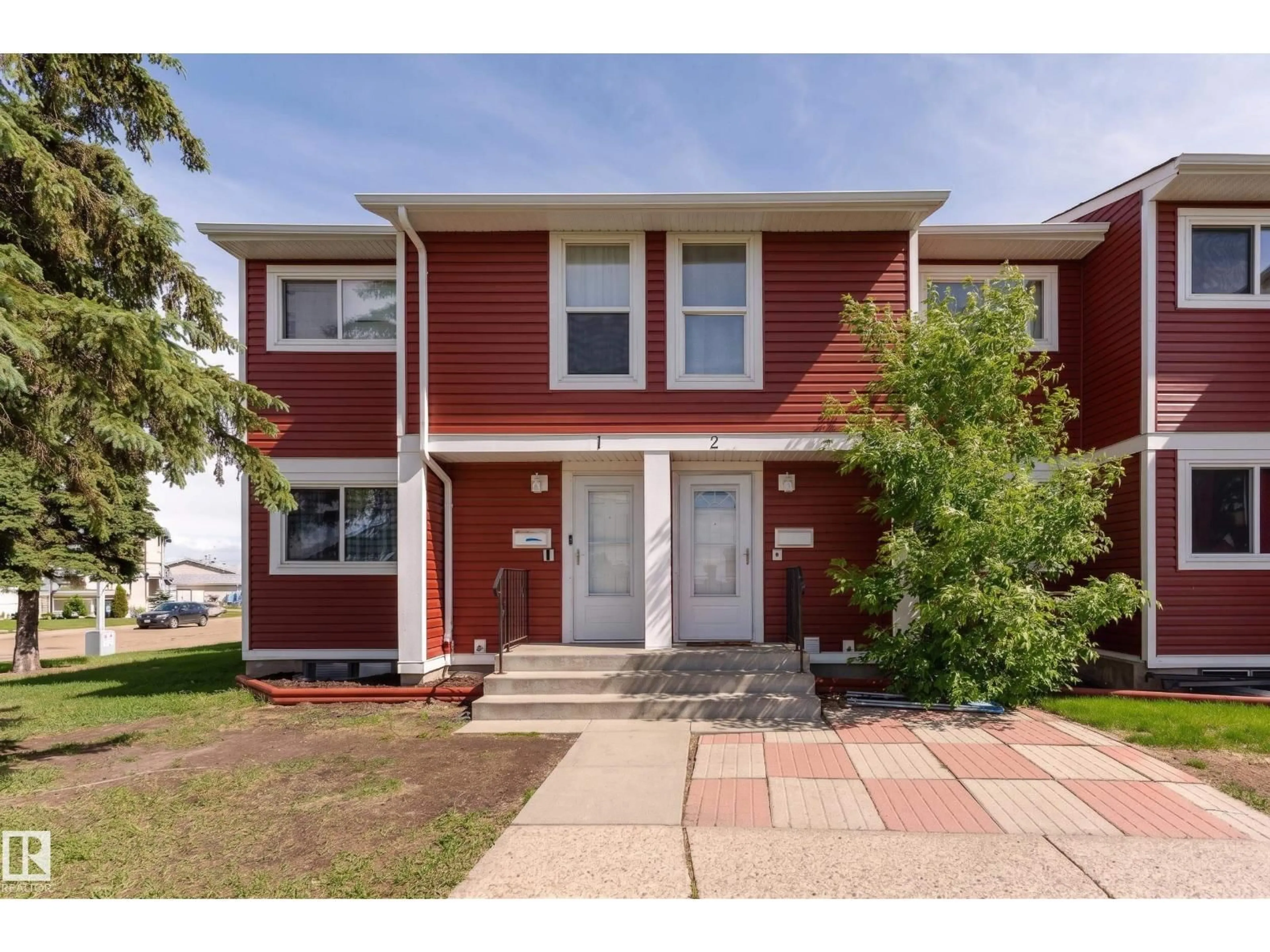 Home with vinyl exterior material, street for #2 - 4707 126 AV, Edmonton Alberta T5A4K4