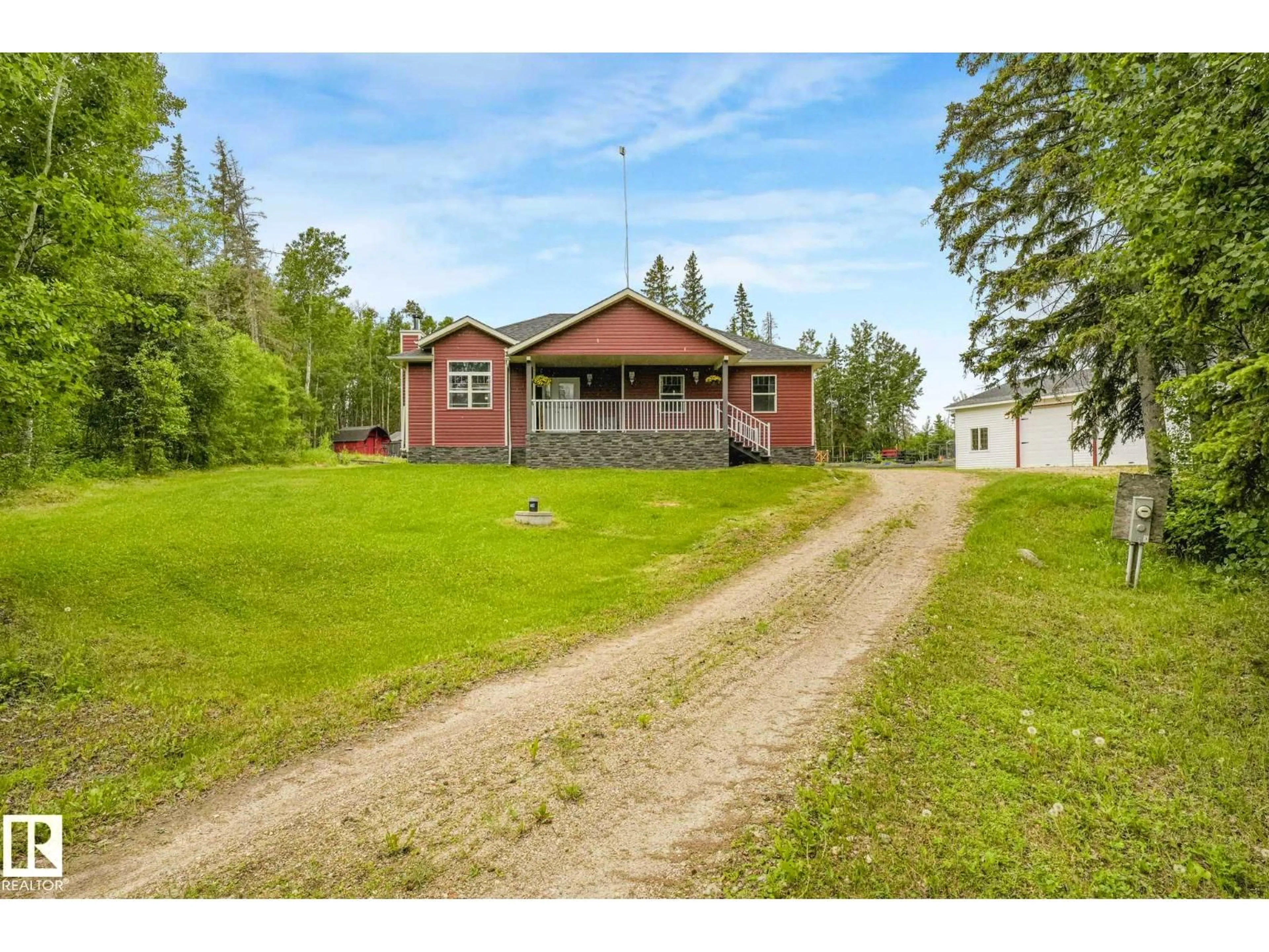 A pic from outside/outdoor area/front of a property/back of a property/a pic from drone, street for 31 - 56110 RGE ROAD 13, Rural Lac Ste. Anne County Alberta T0E1V0