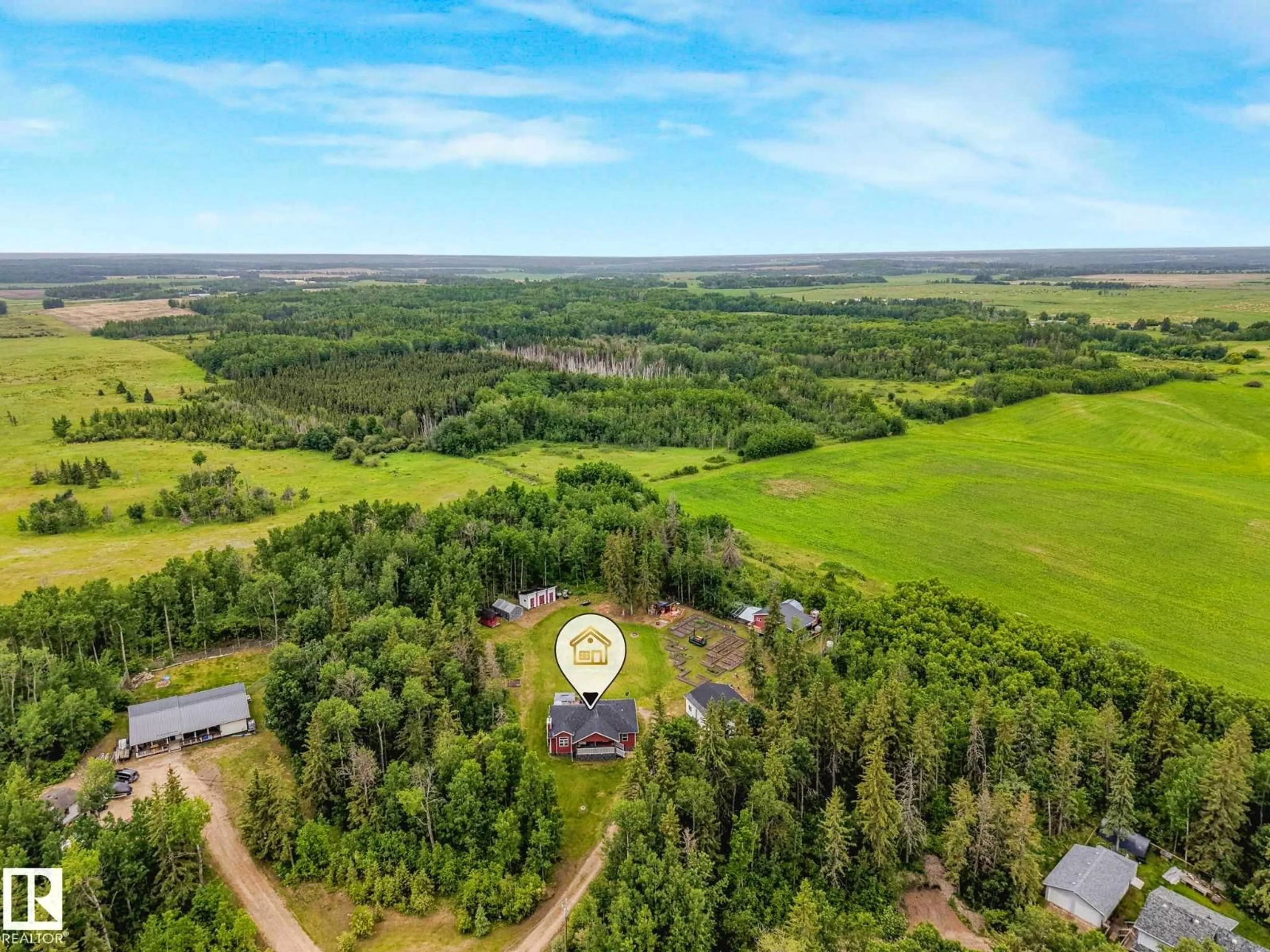 A pic from outside/outdoor area/front of a property/back of a property/a pic from drone, forest/trees view for 31 - 56110 RGE ROAD 13, Rural Lac Ste. Anne County Alberta T0E1V0