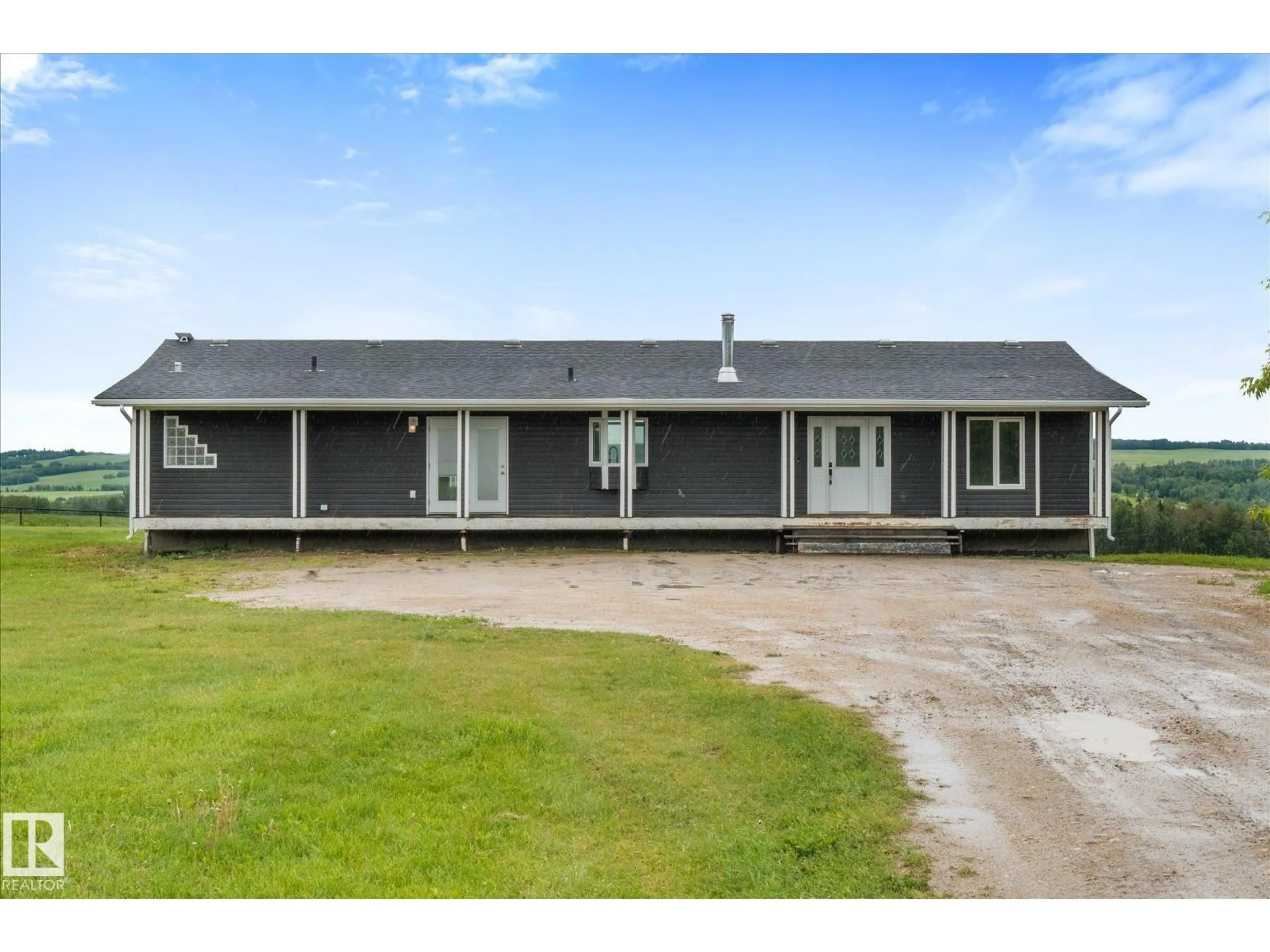 A pic from outside/outdoor area/front of a property/back of a property/a pic from drone, building for 8223 TWP ROAD 590, Rural Lac Ste. Anne County Alberta T0E1N0