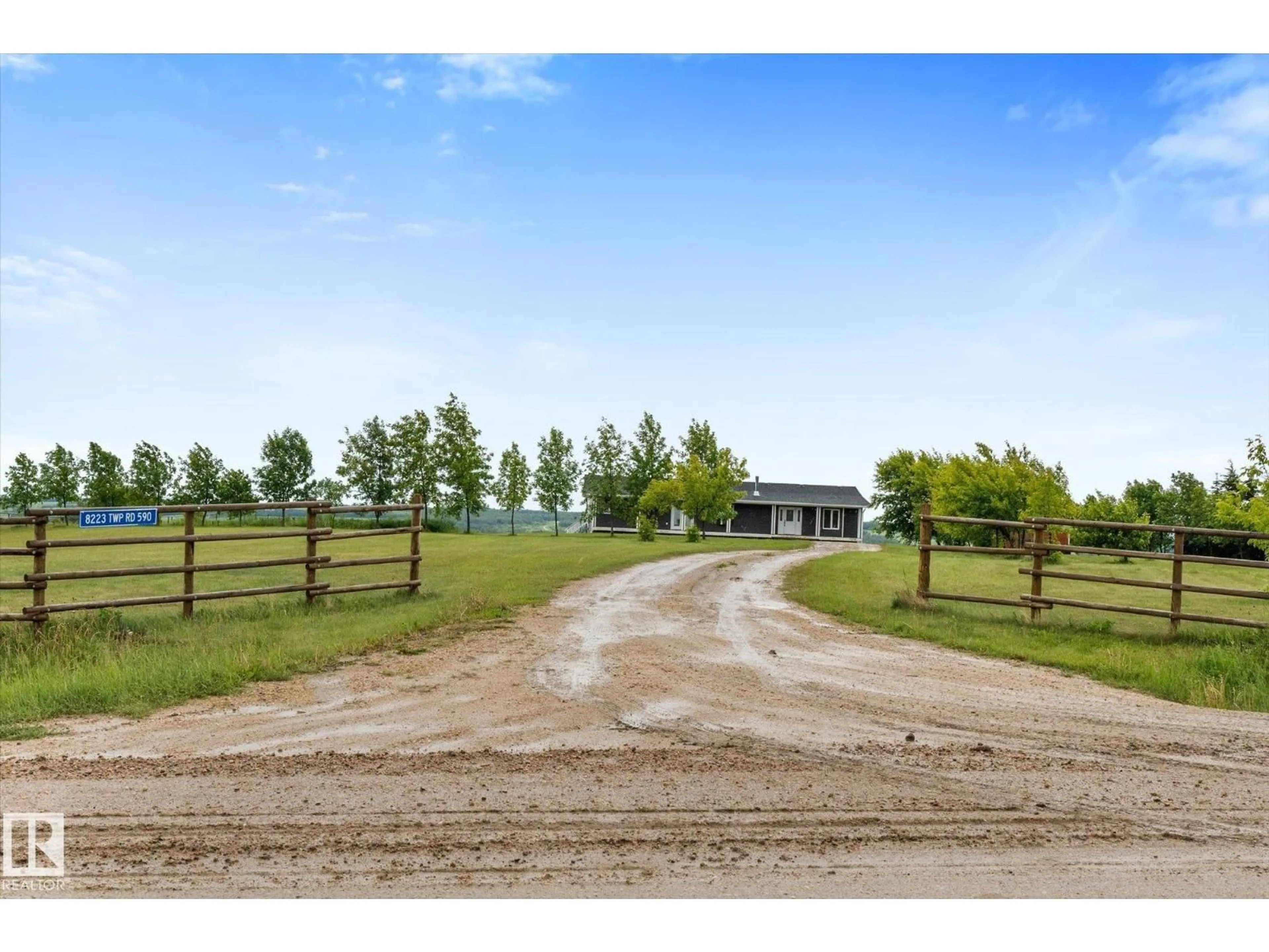 A pic from outside/outdoor area/front of a property/back of a property/a pic from drone, water/lake/river/ocean view for 8223 TWP ROAD 590, Rural Lac Ste. Anne County Alberta T0E1N0