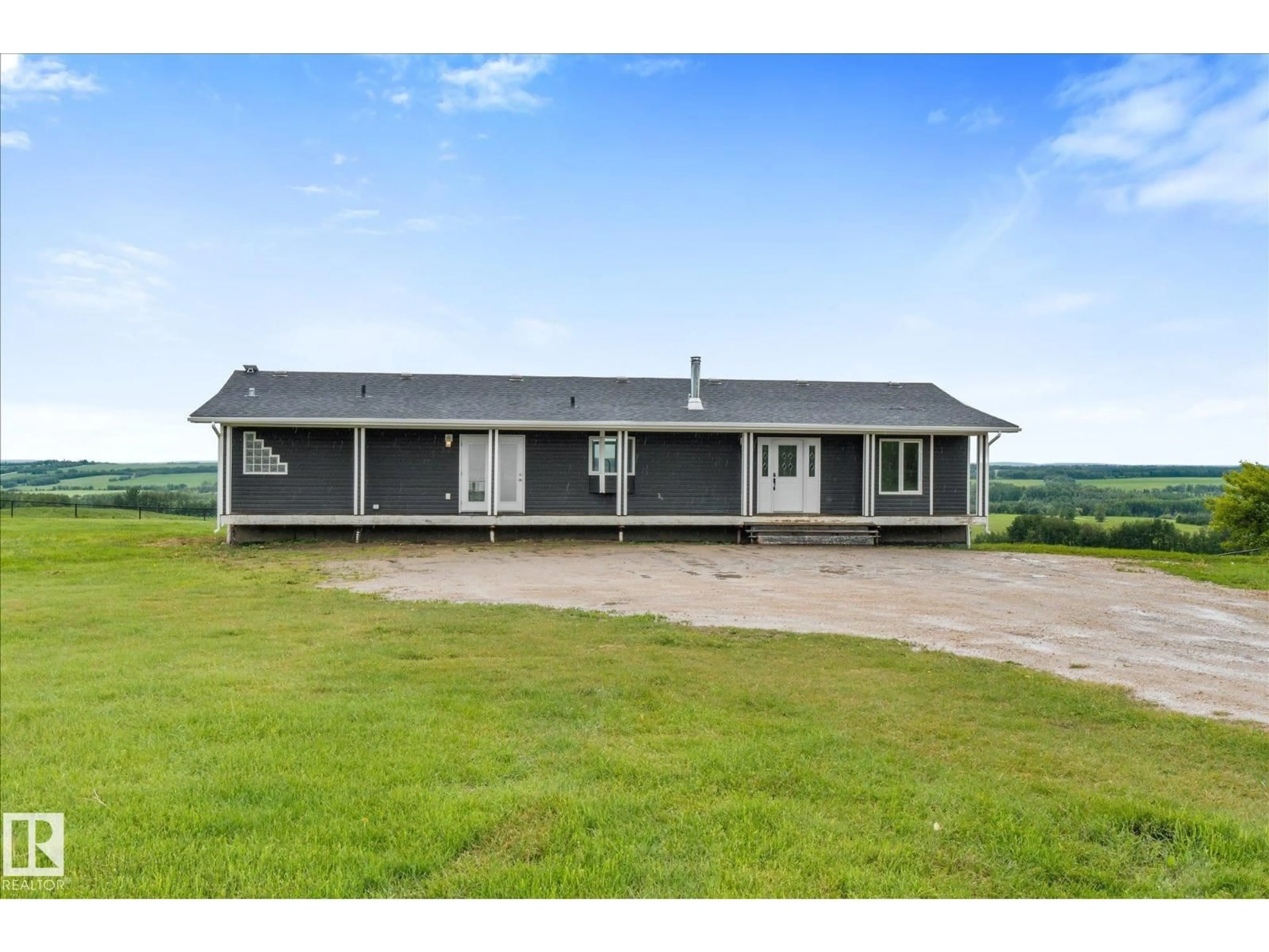 A pic from outside/outdoor area/front of a property/back of a property/a pic from drone, building for 8223 TWP ROAD 590, Rural Lac Ste. Anne County Alberta T0E1N0