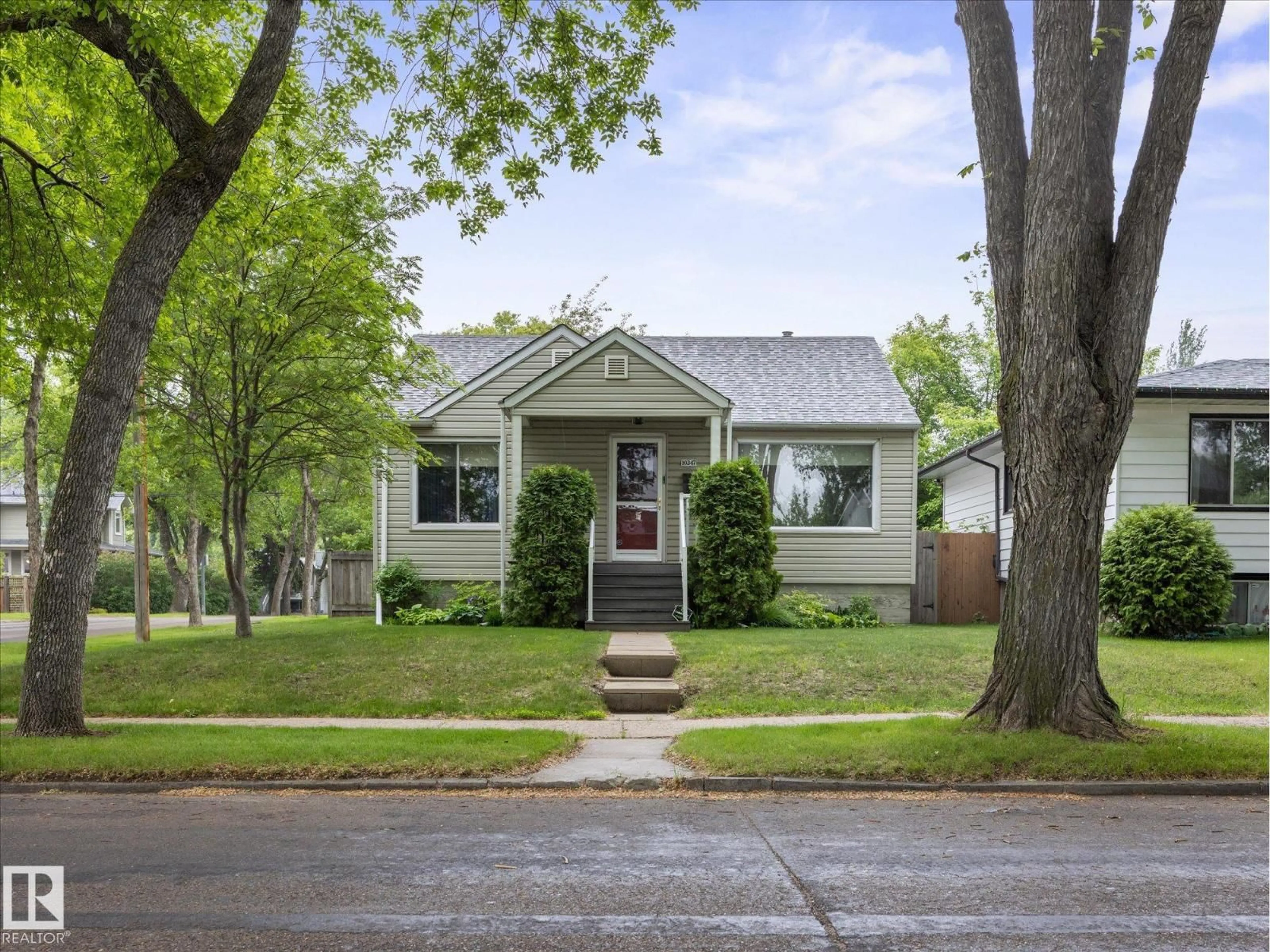 Home with vinyl exterior material, street for 10347 83 ST, Edmonton Alberta T6A3N9