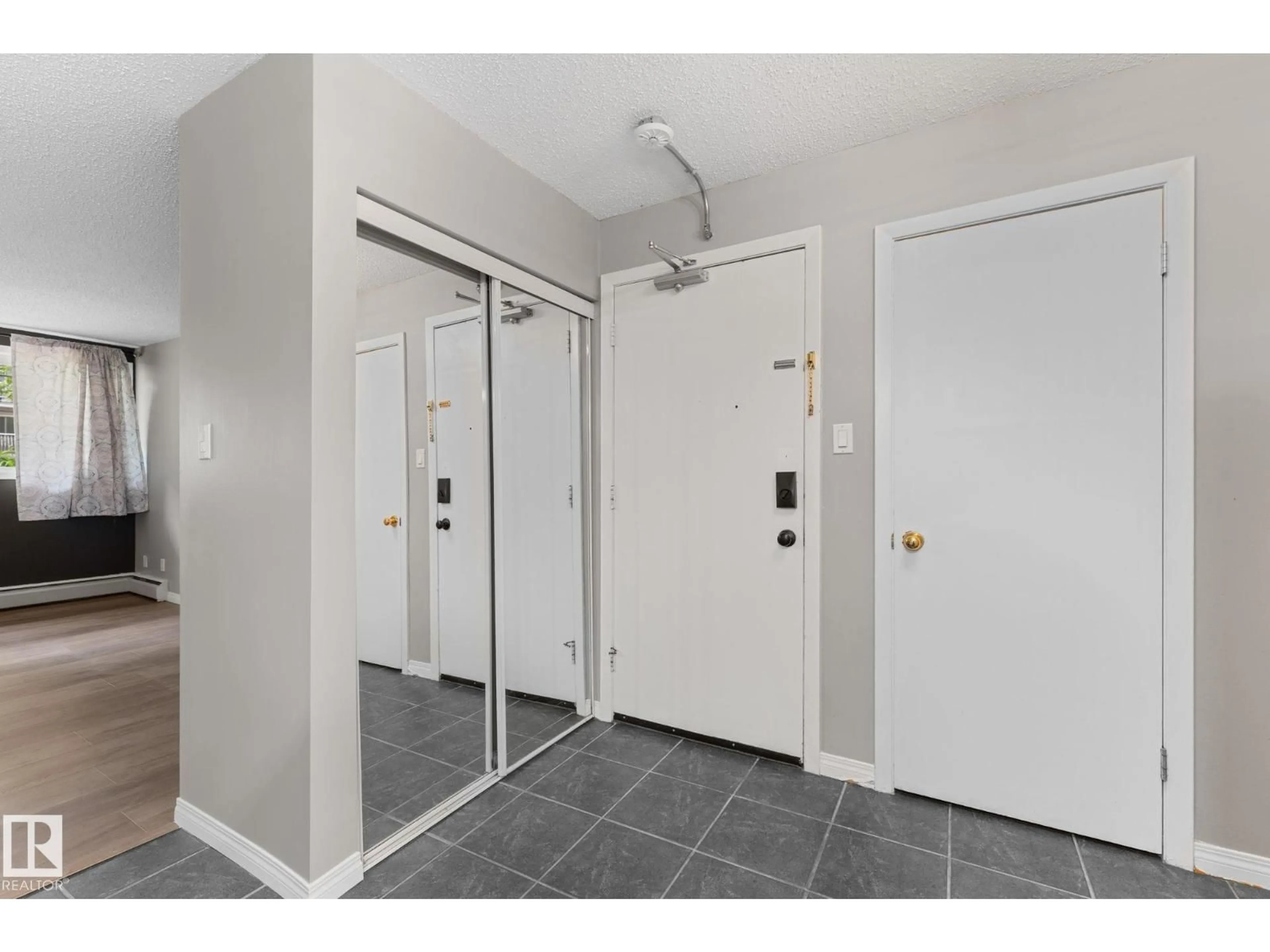 Indoor entryway for 102 - 10225 114 ST NW, Edmonton Alberta T5K1S1