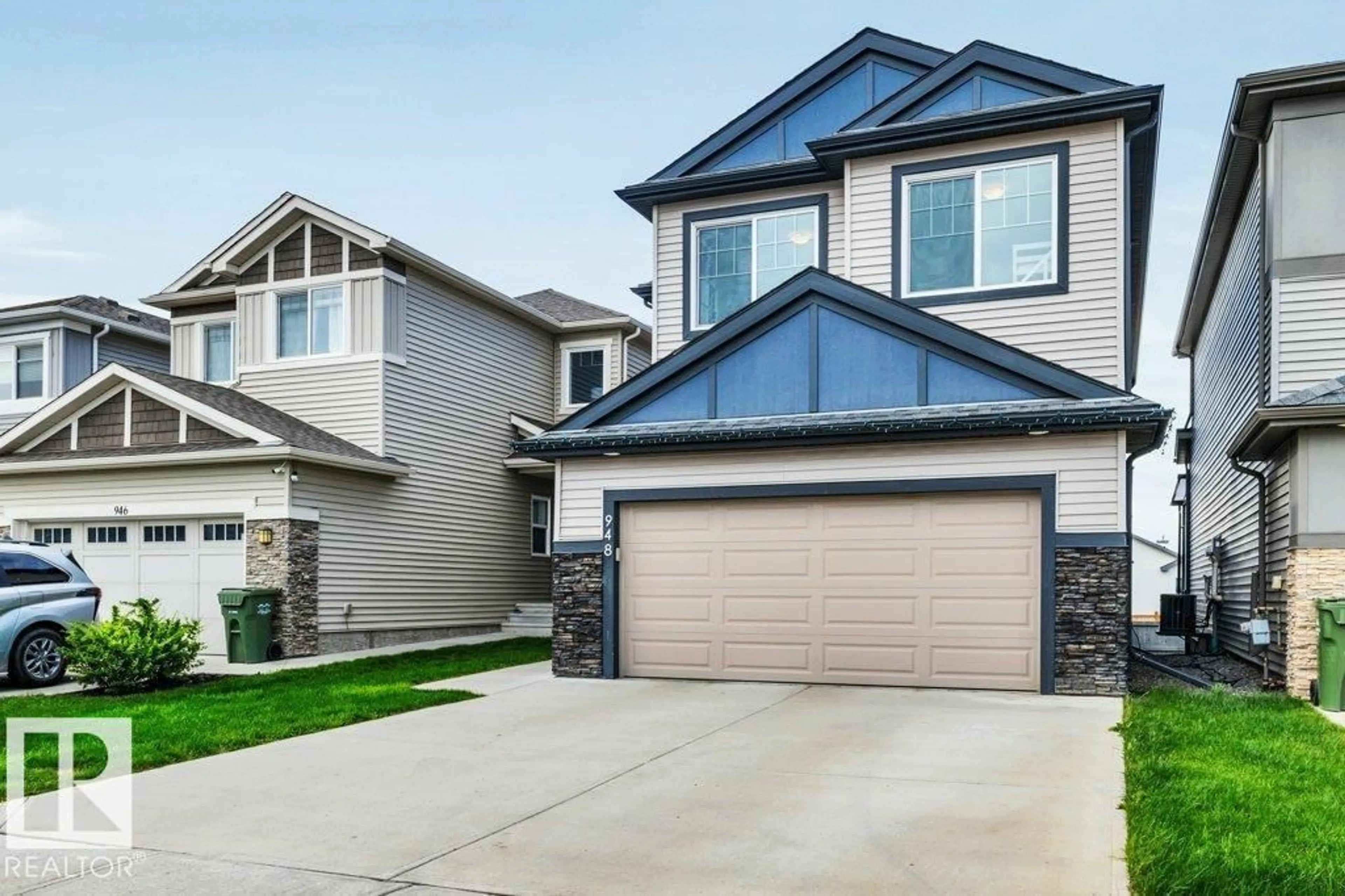 Home with vinyl exterior material, street for 948 BERG PL, Leduc Alberta T9E1J6