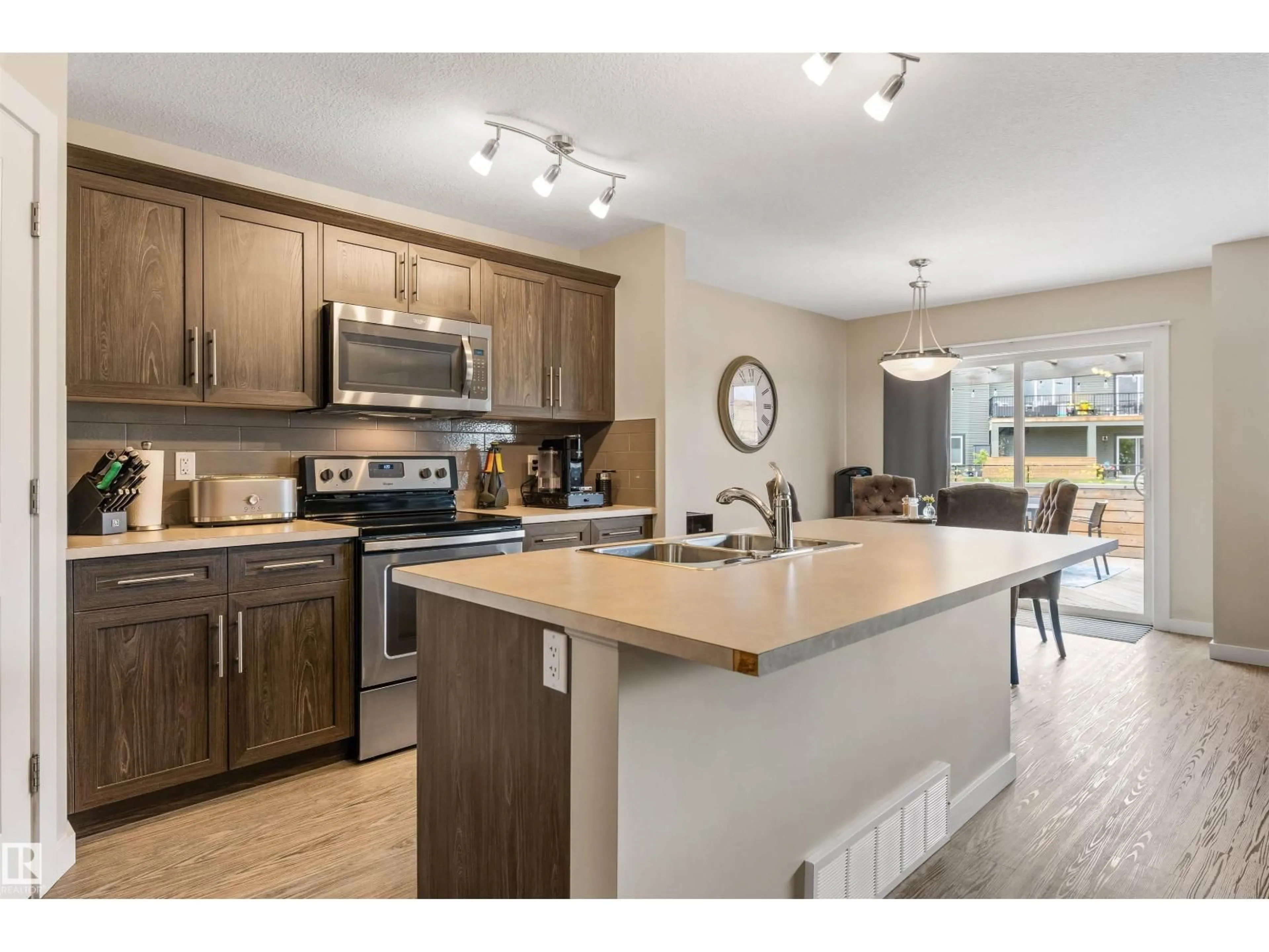 Open concept kitchen, wood/laminate floor for NW - 20530 128 AV, Edmonton Alberta T5S0L8