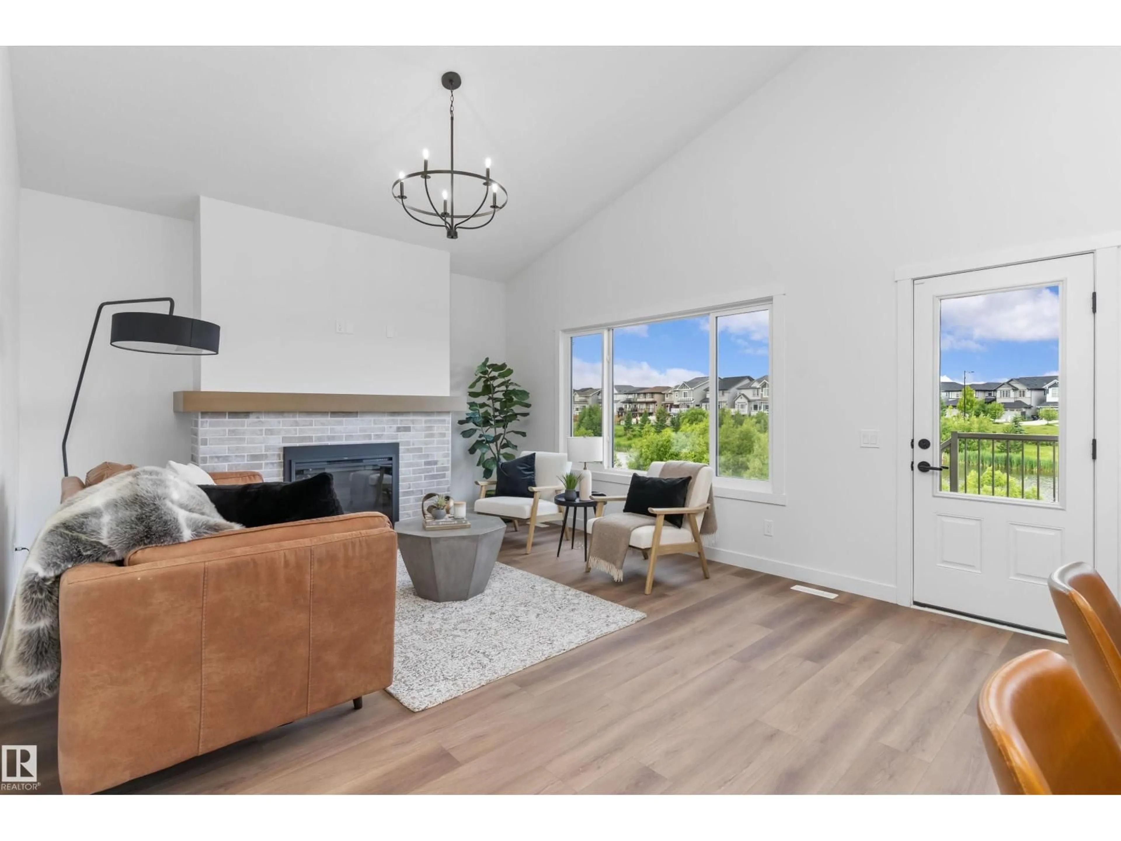 Living room with furniture, wood/laminate floor for 3708 CROSS LANDING SW, Edmonton Alberta T6W4M8
