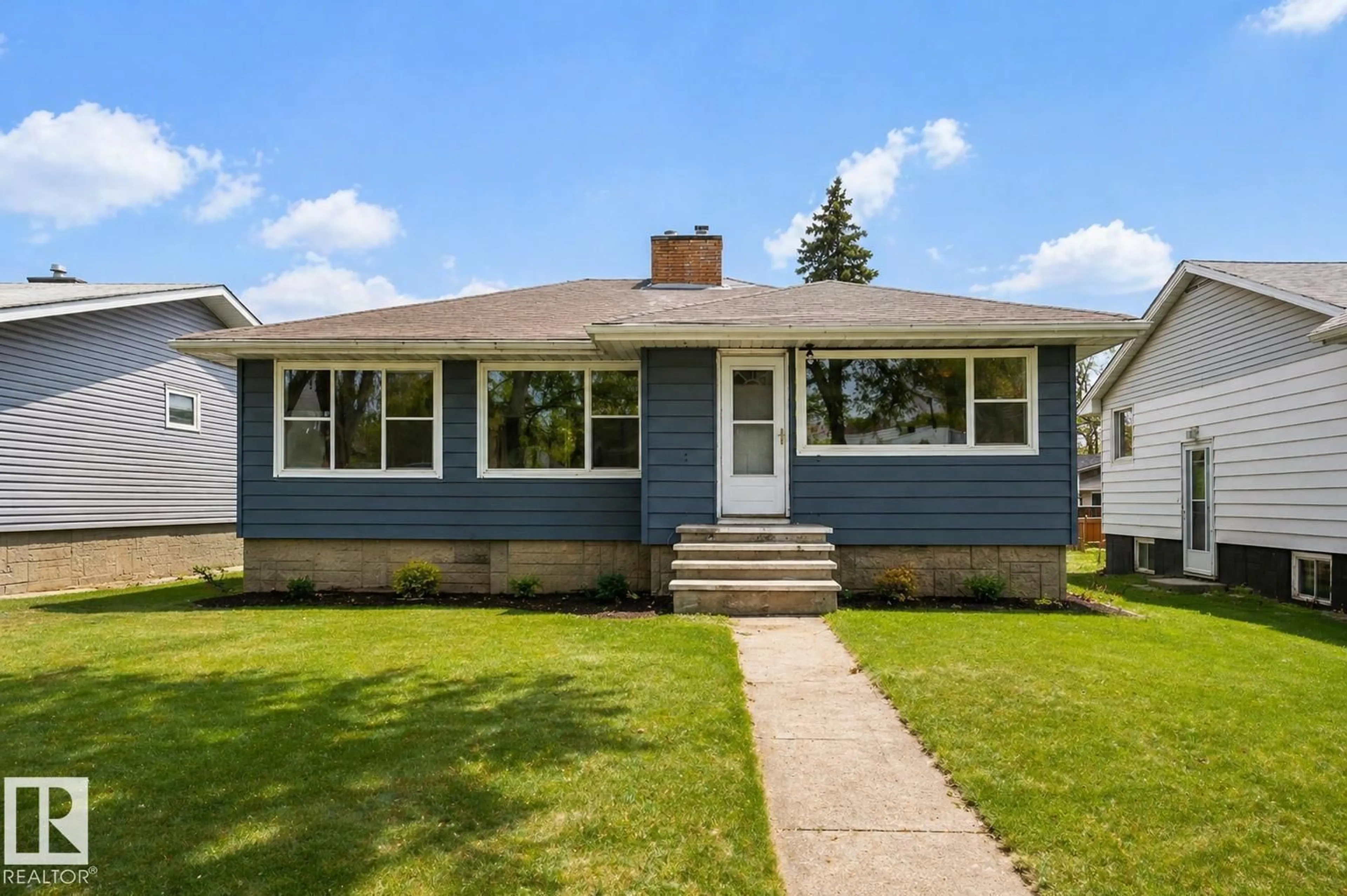 Home with vinyl exterior material, street for 12220 51 ST, Edmonton Alberta T5W3H2