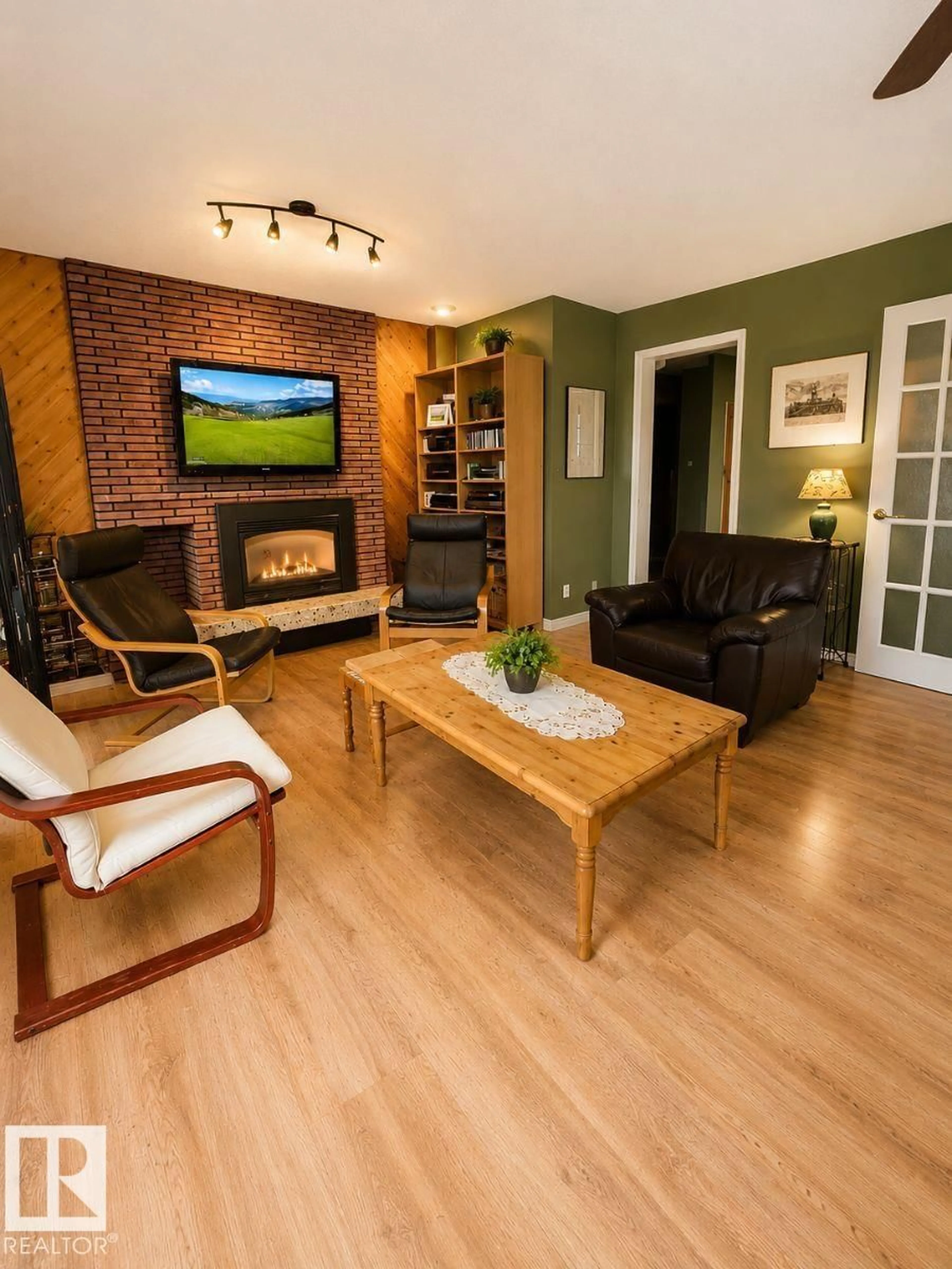 Living room with furniture, wood/laminate floor for 11015 144 ST, Edmonton Alberta T5N2W4