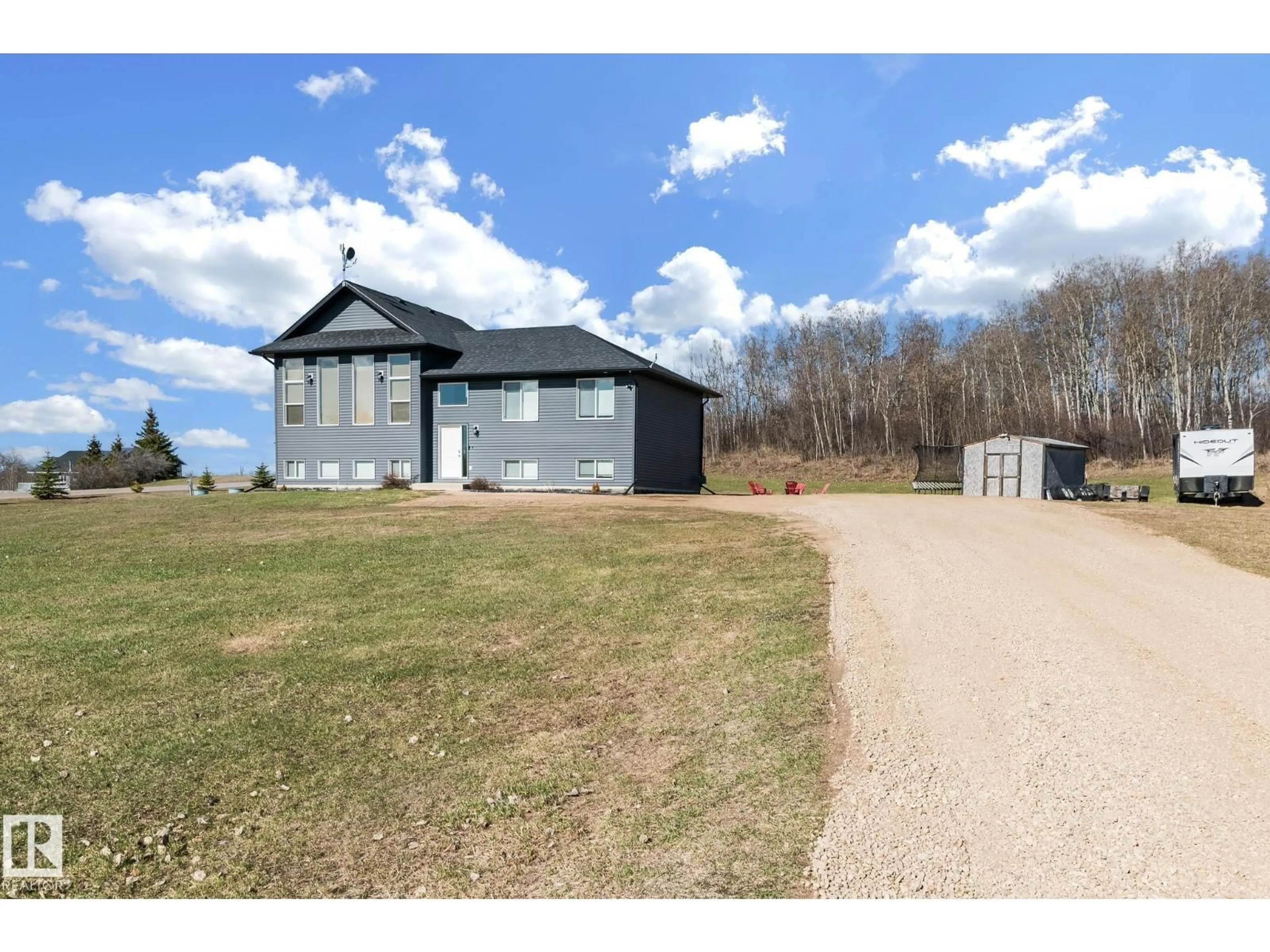 A pic from outside/outdoor area/front of a property/back of a property/a pic from drone, water/lake/river/ocean view for 61119 - 24 RGE RD 465, Rural Bonnyville M.D. Alberta T9N2J6
