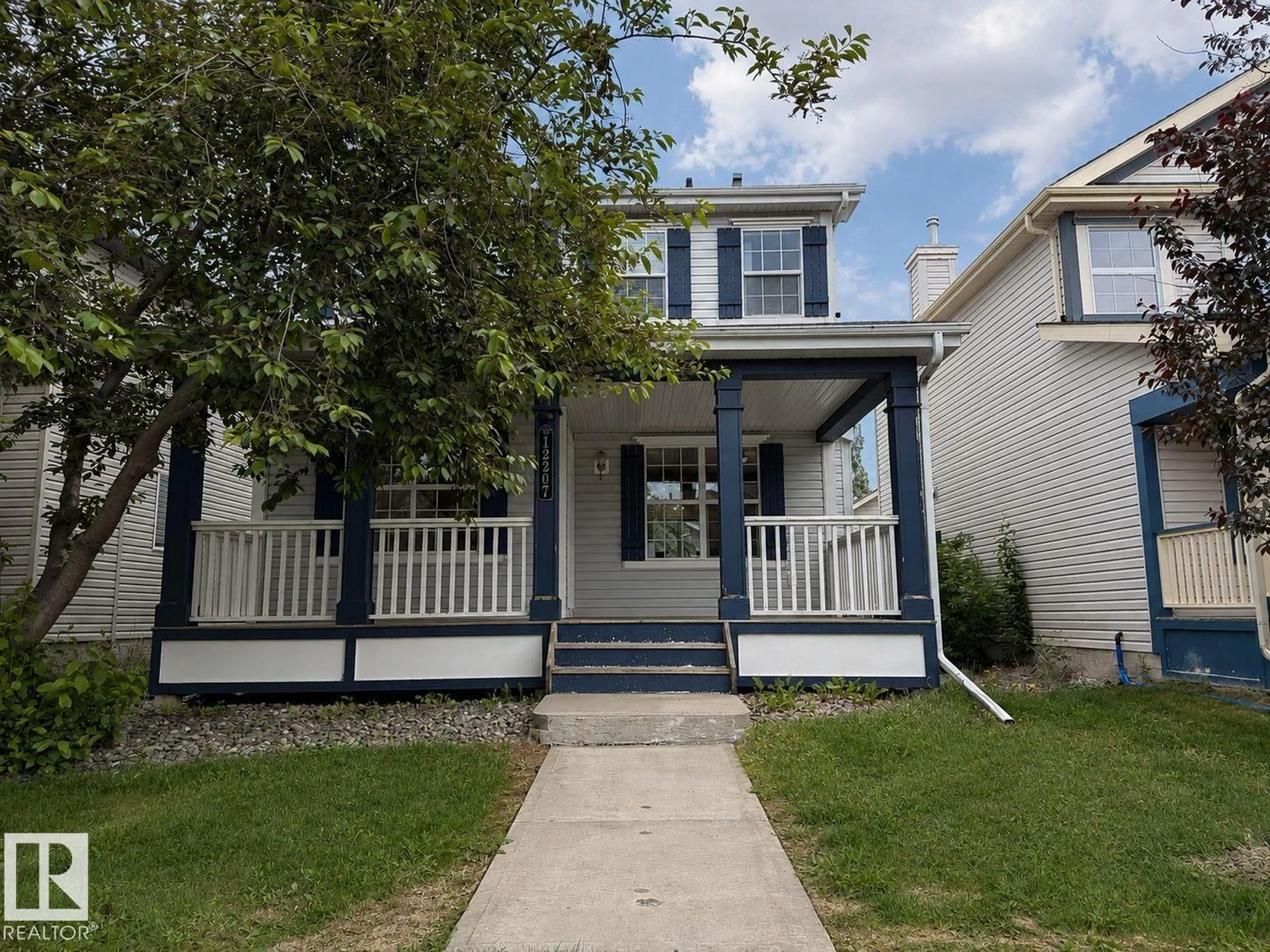Home with vinyl exterior material, street for 12207 16 AV, Edmonton Alberta T6W1L8