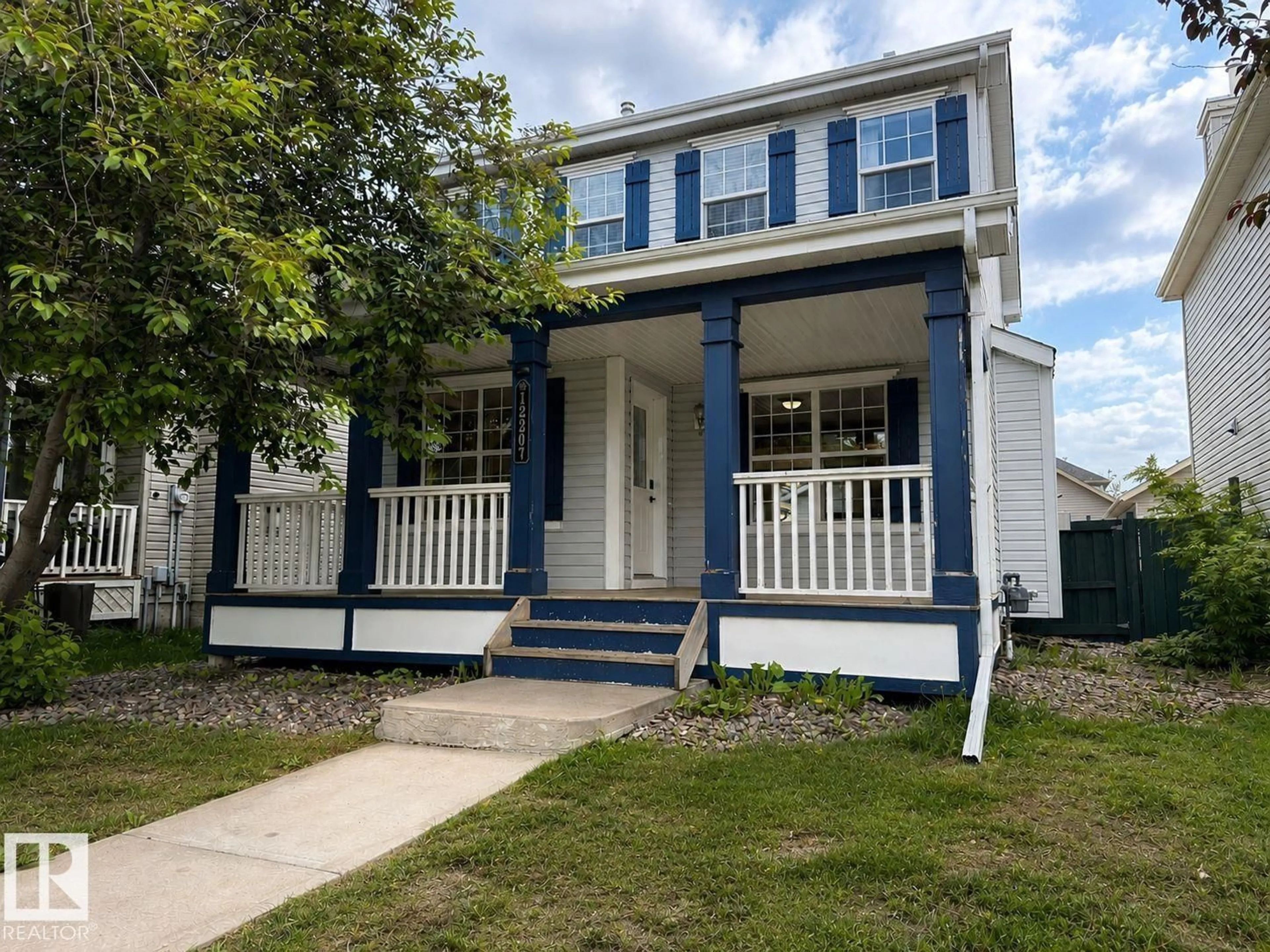 Home with vinyl exterior material, street for 12207 16 AV, Edmonton Alberta T6W1L8
