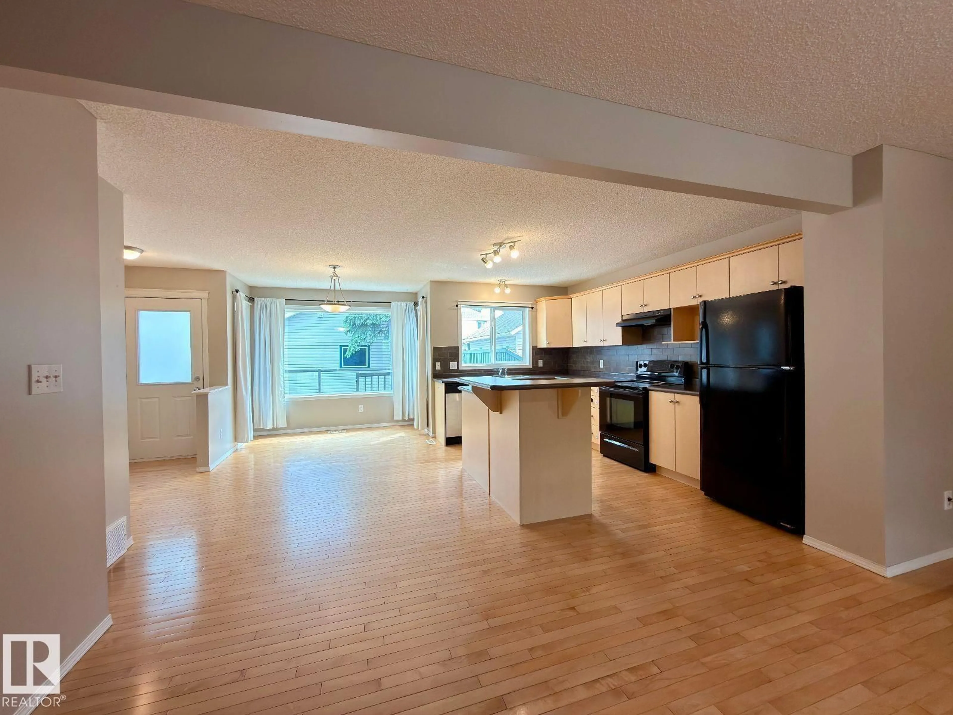 Open concept kitchen, unknown for 12207 16 AV, Edmonton Alberta T6W1L8