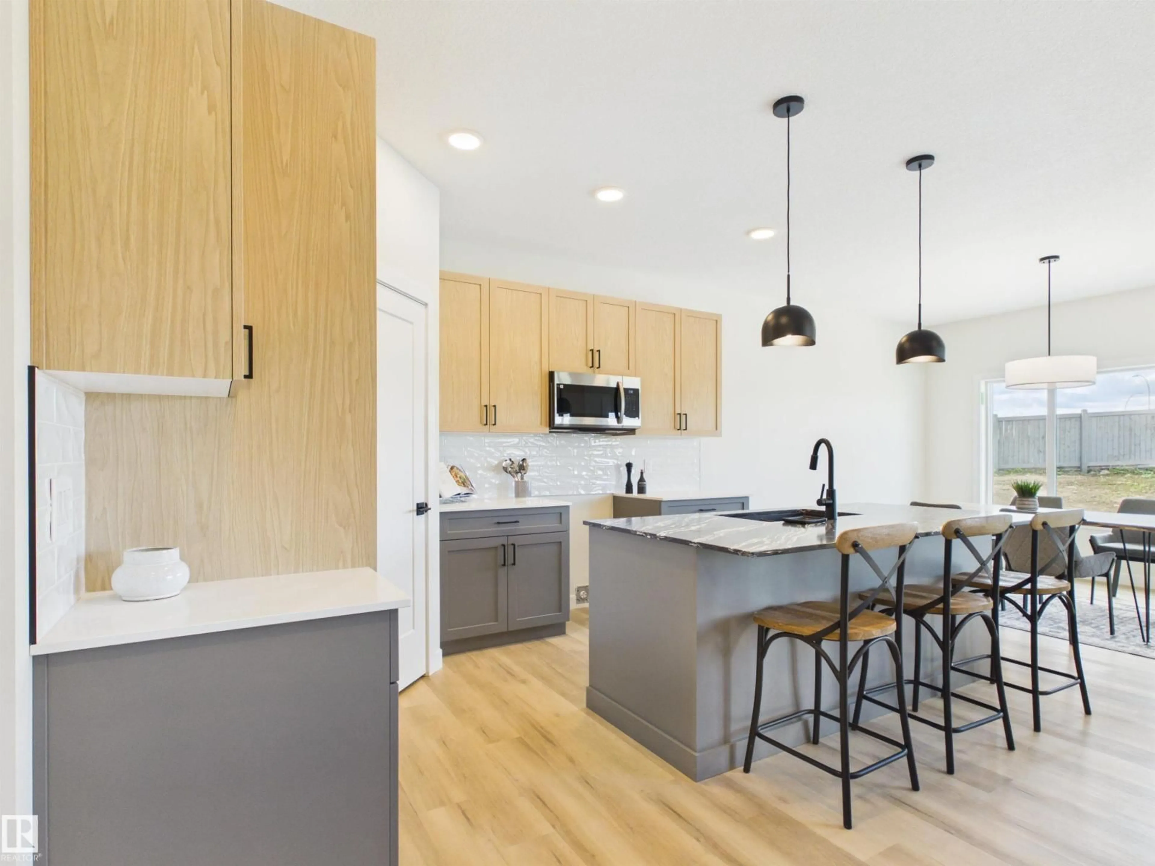 Open concept kitchen, wood/laminate floor for 189 CALEDON CR, Spruce Grove Alberta T7X4E3