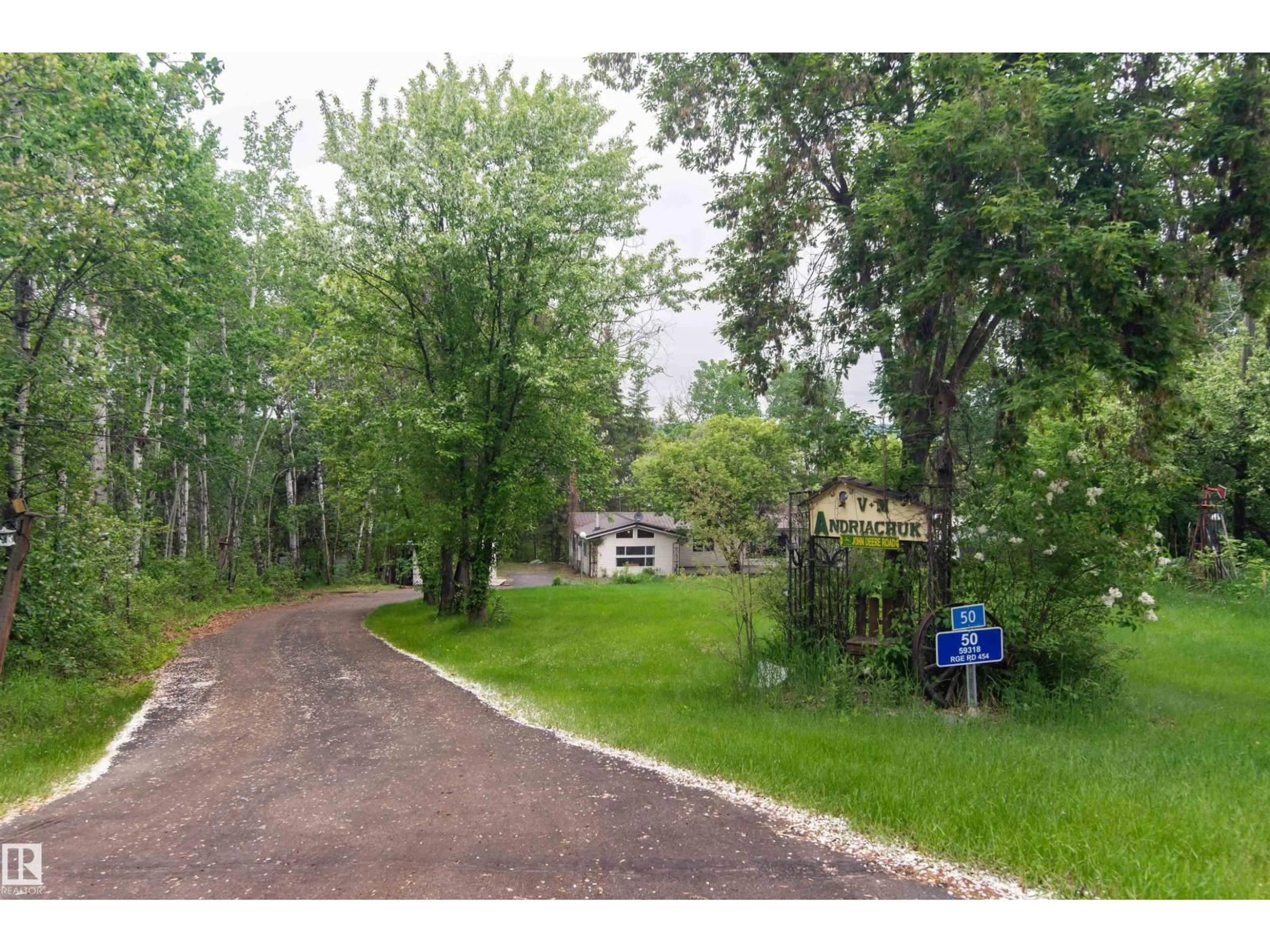 A pic from outside/outdoor area/front of a property/back of a property/a pic from drone, forest/trees view for 50 59318 RG RD RD, Rural Bonnyville M.D. Alberta T9N0H2