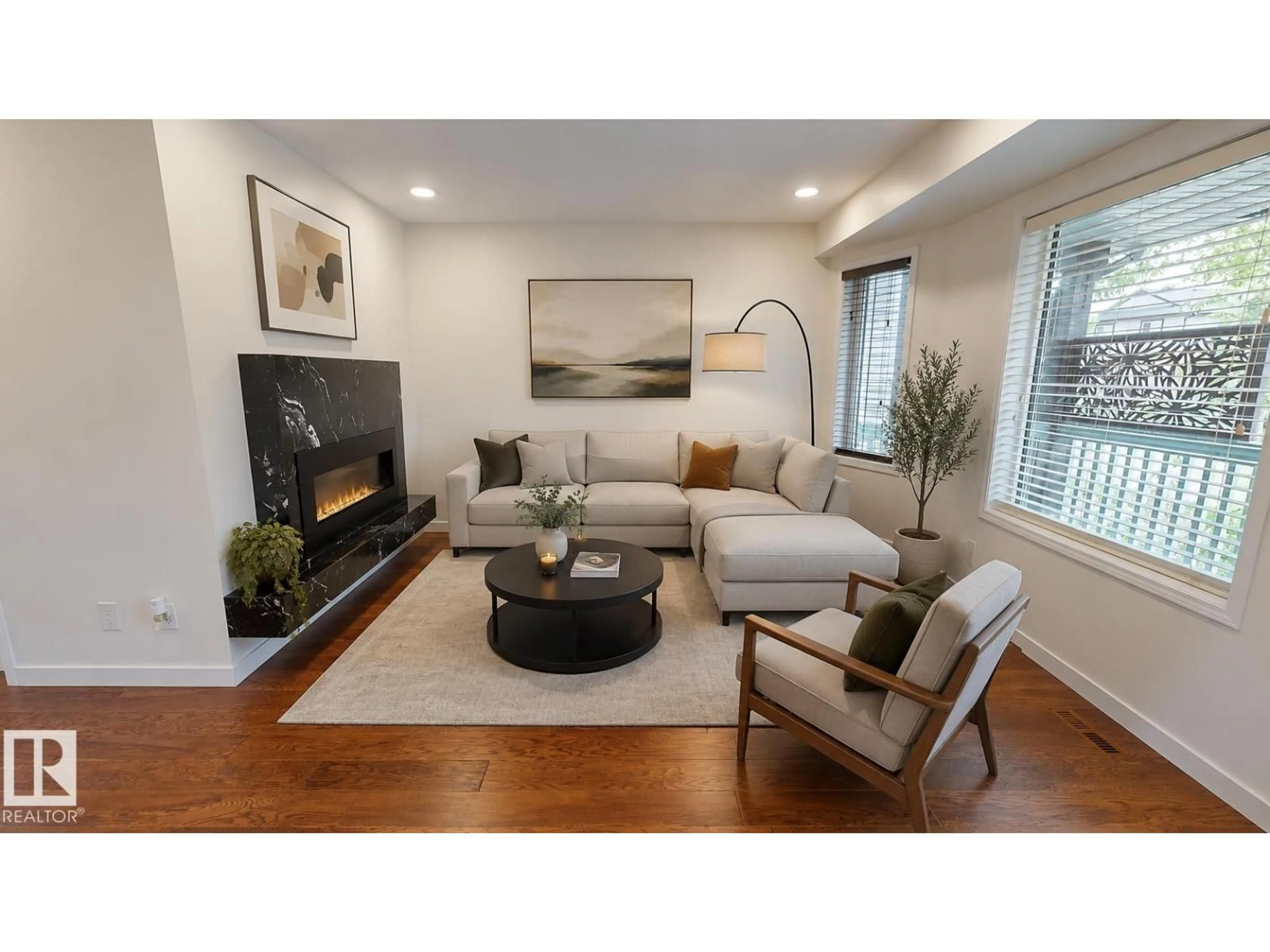 Living room with furniture, wood/laminate floor for 4756 156 AV, Edmonton Alberta T5Y0B5