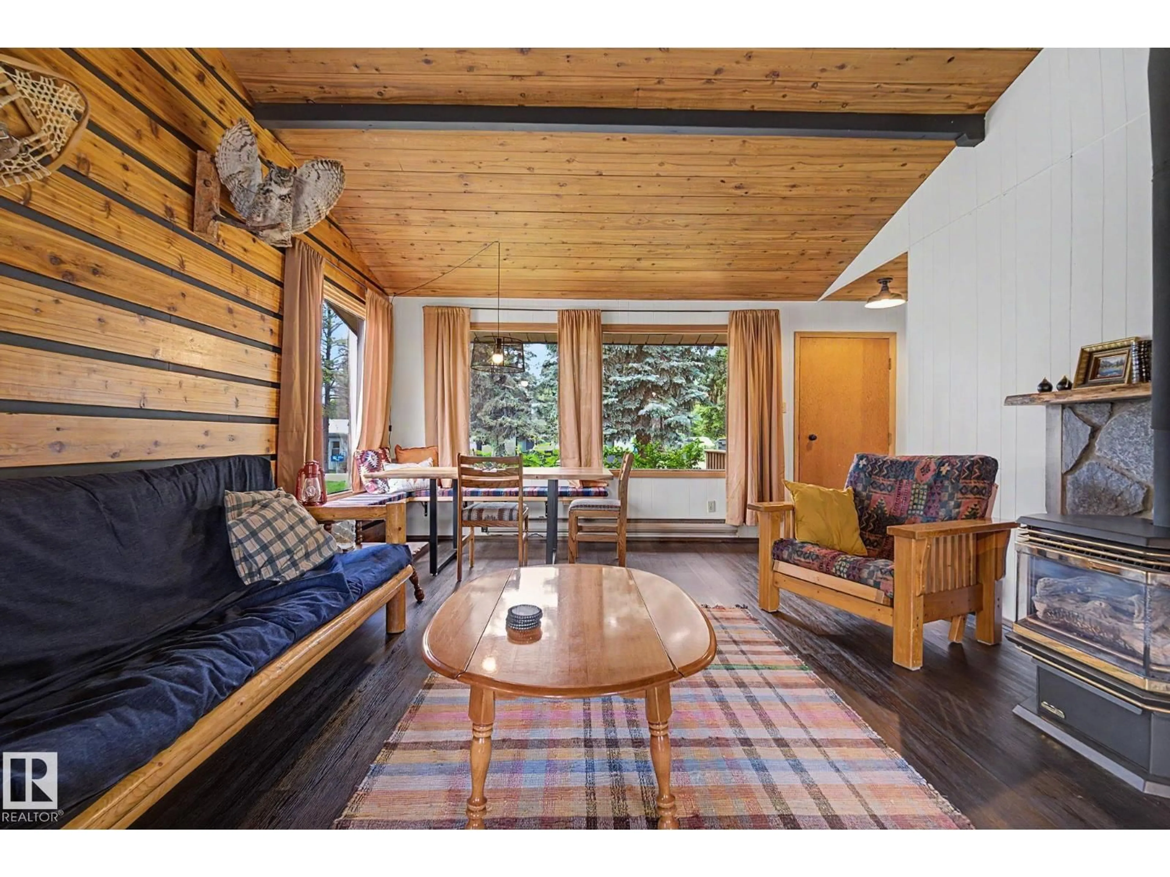 Living room with furniture, wood/laminate floor for 308 3 ST, Rural Lac Ste. Anne County Alberta T0E1A0