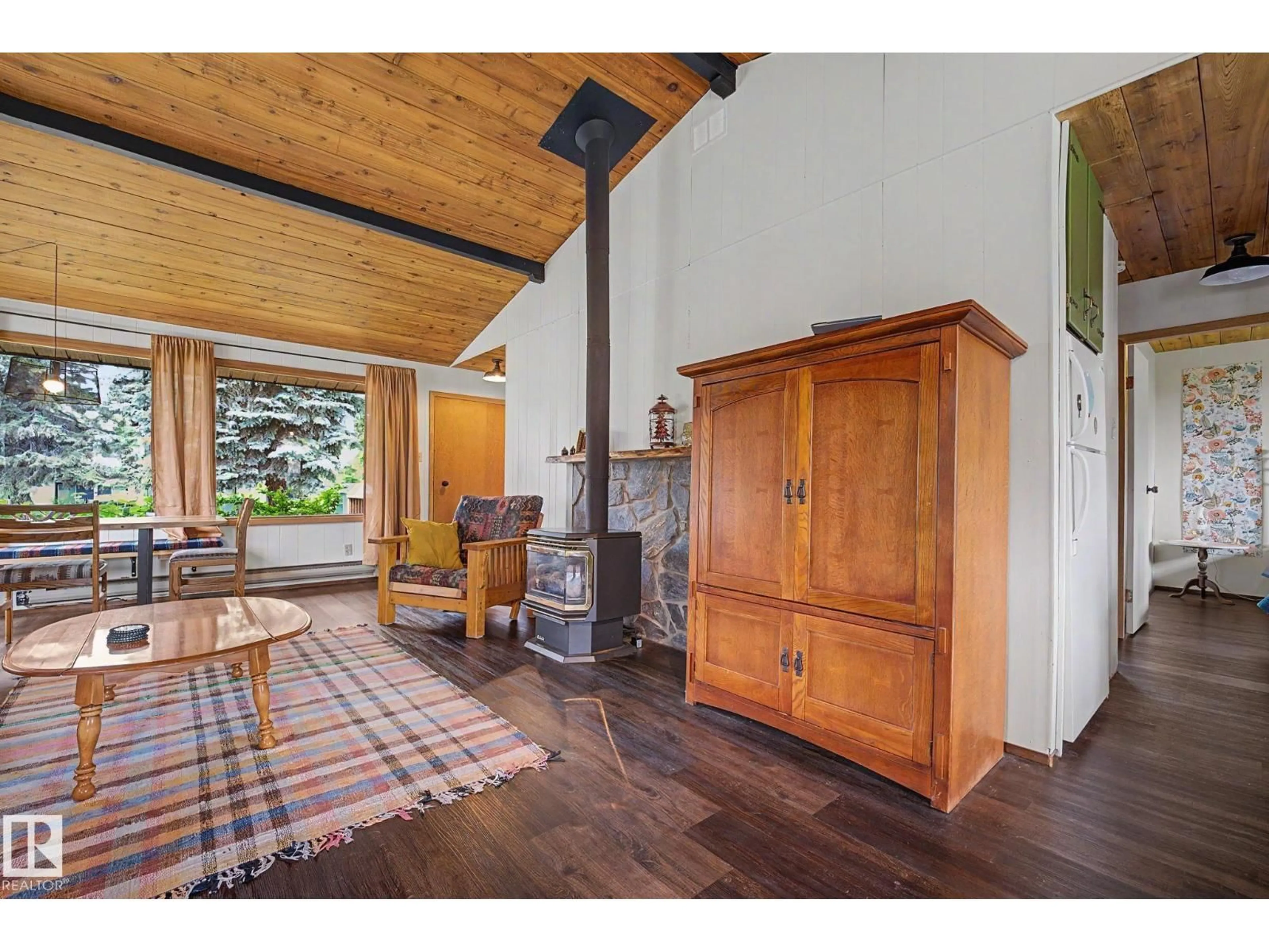 Living room with furniture, wood/laminate floor for 308 3 ST, Rural Lac Ste. Anne County Alberta T0E1A0