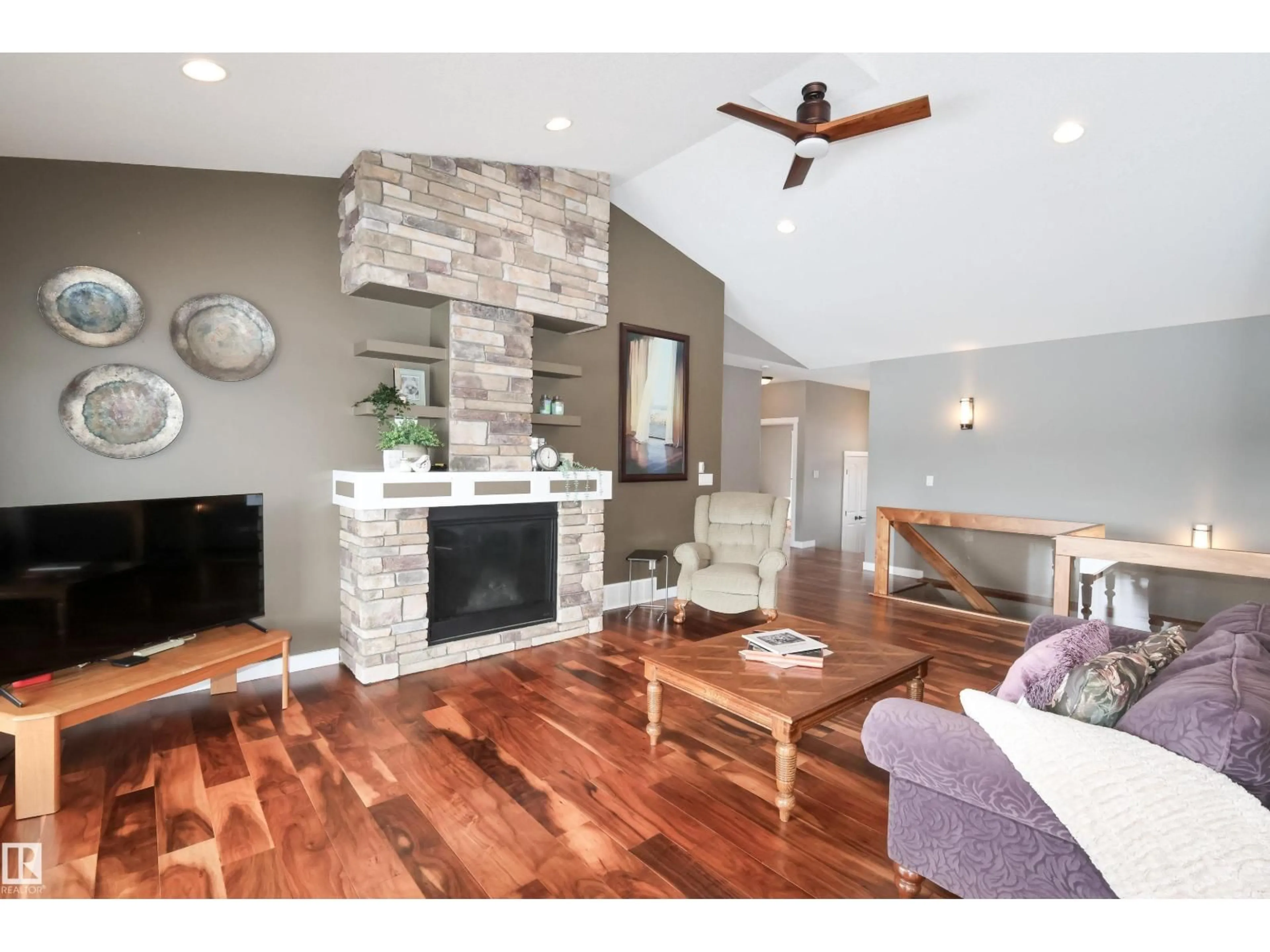 Living room with furniture, wood/laminate floor for 10508 103, Morinville Alberta T8R0E7