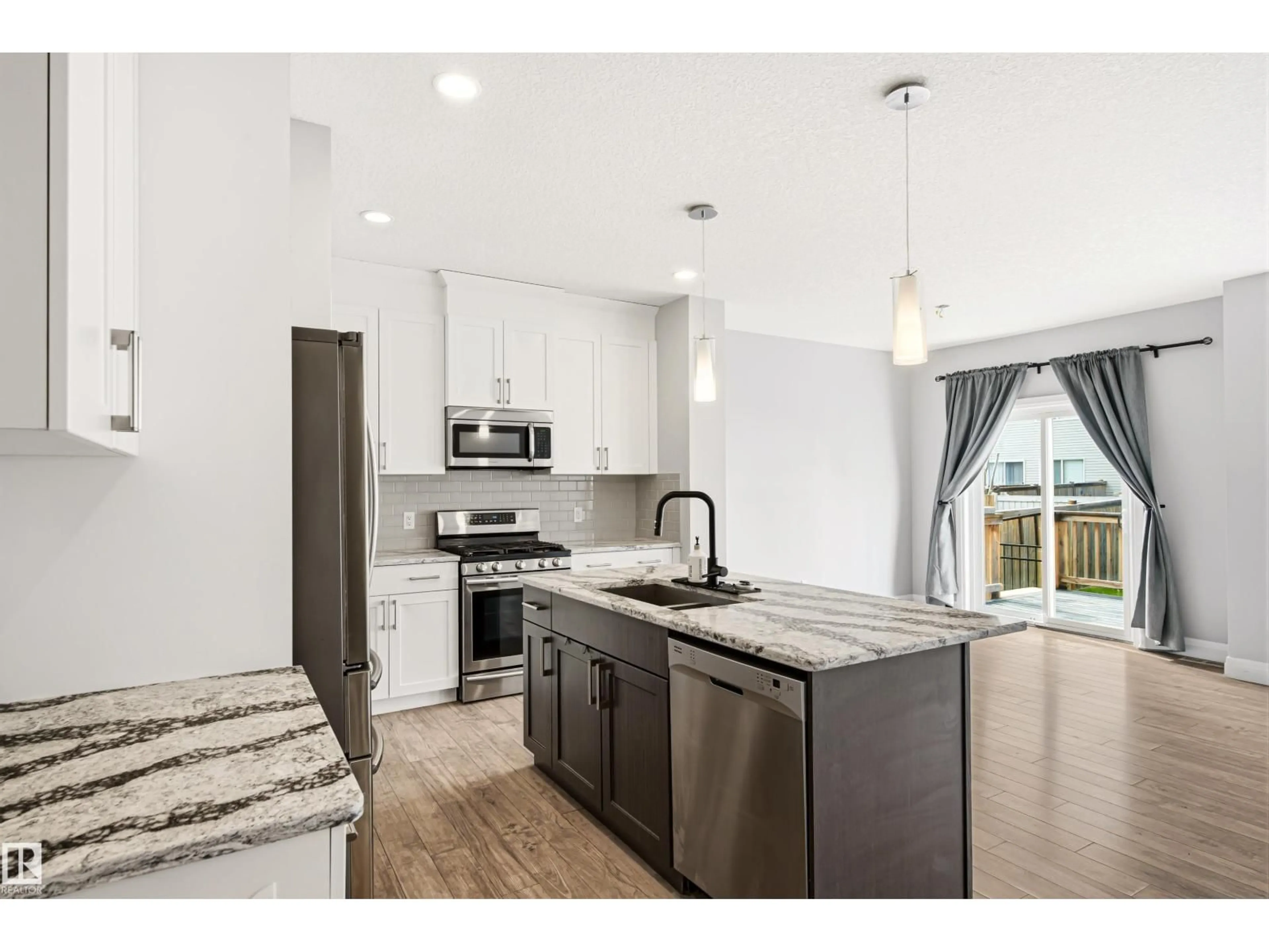 Open concept kitchen, ceramic/tile floor for 102 MEADOWLAND WY, Spruce Grove Alberta T7X0S4