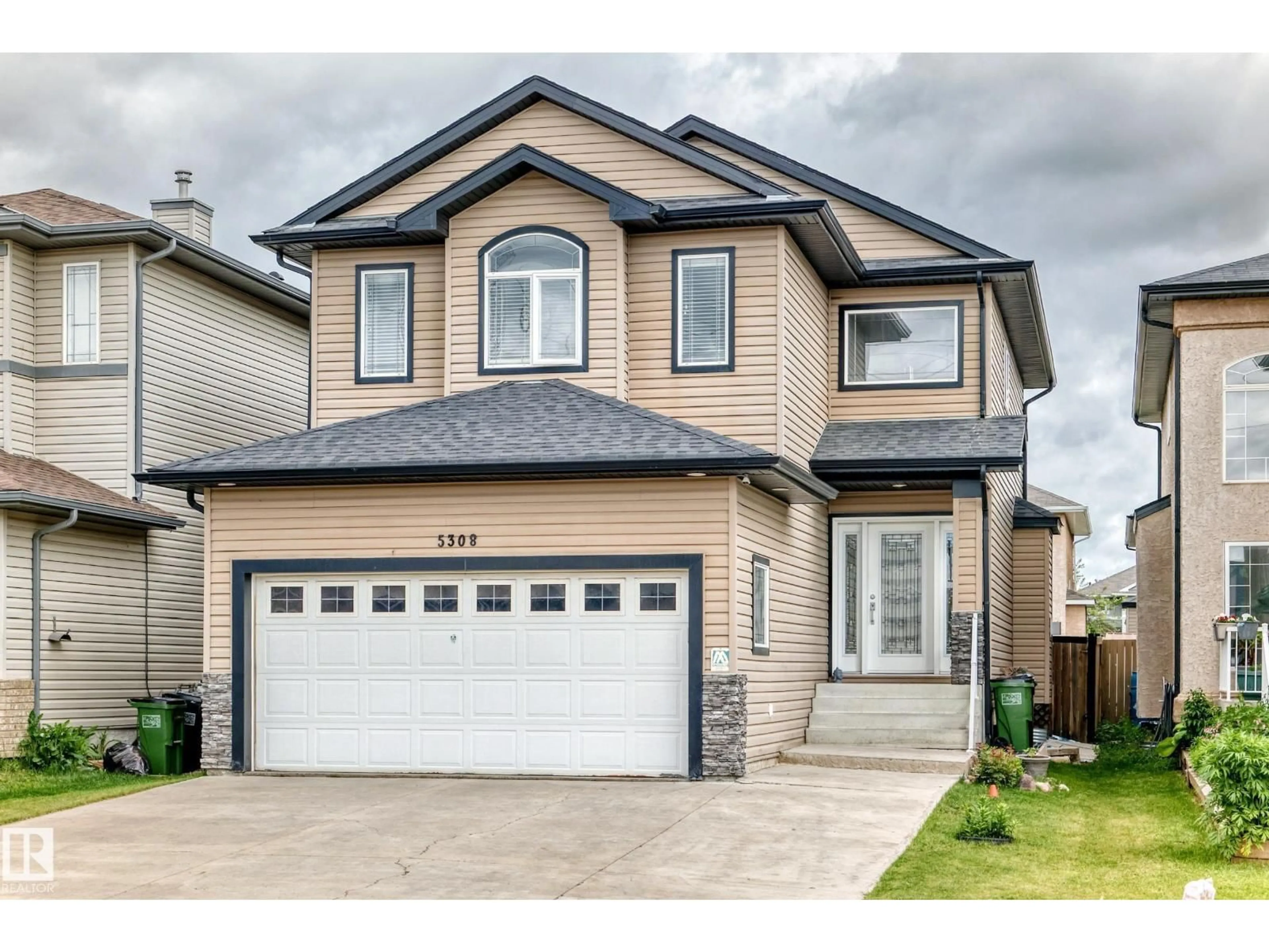 Home with vinyl exterior material, street for 5308 164 AV, Edmonton Alberta T5Y0H4