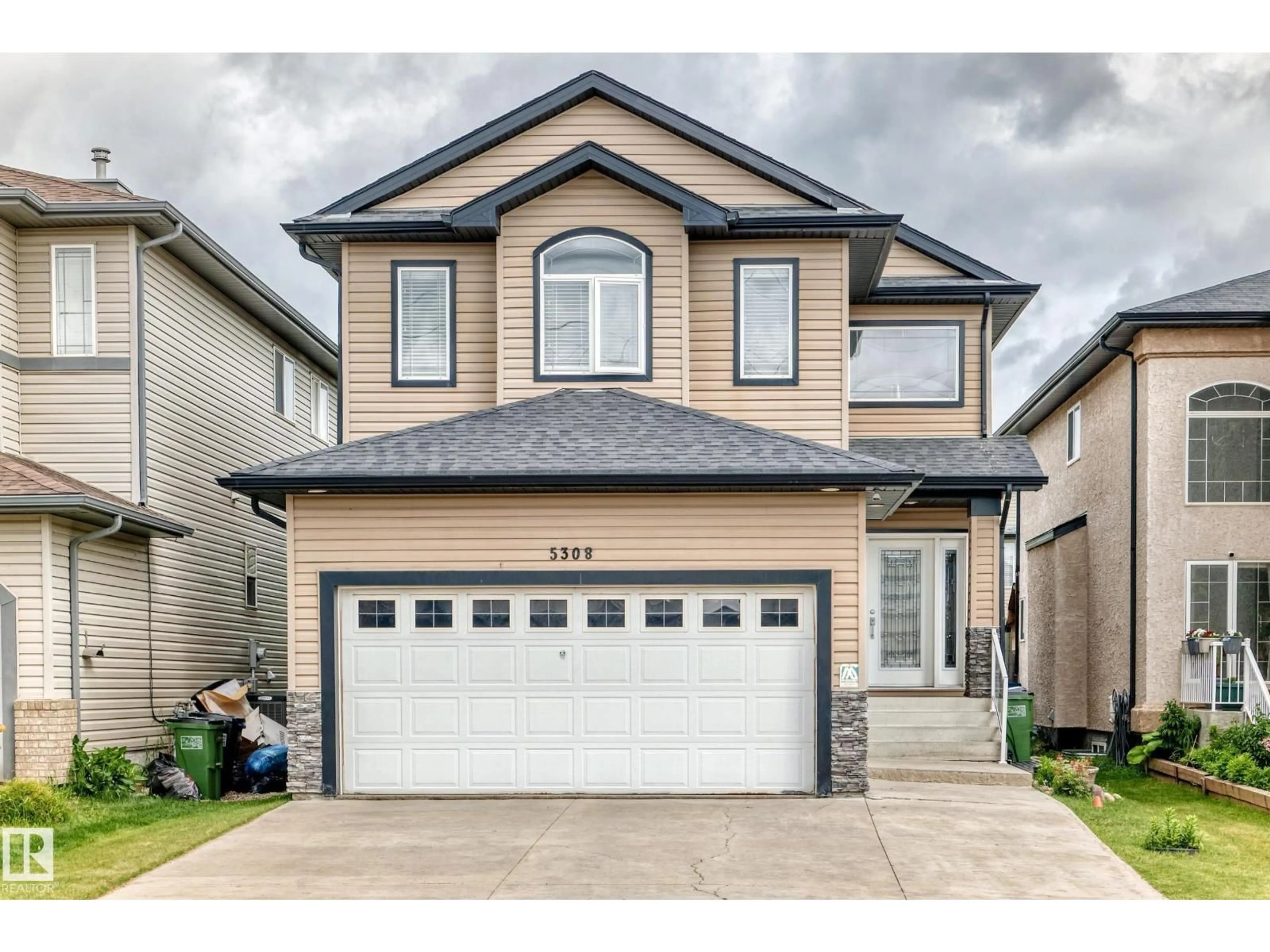 Home with vinyl exterior material, street for 5308 164 AV, Edmonton Alberta T5Y0H4