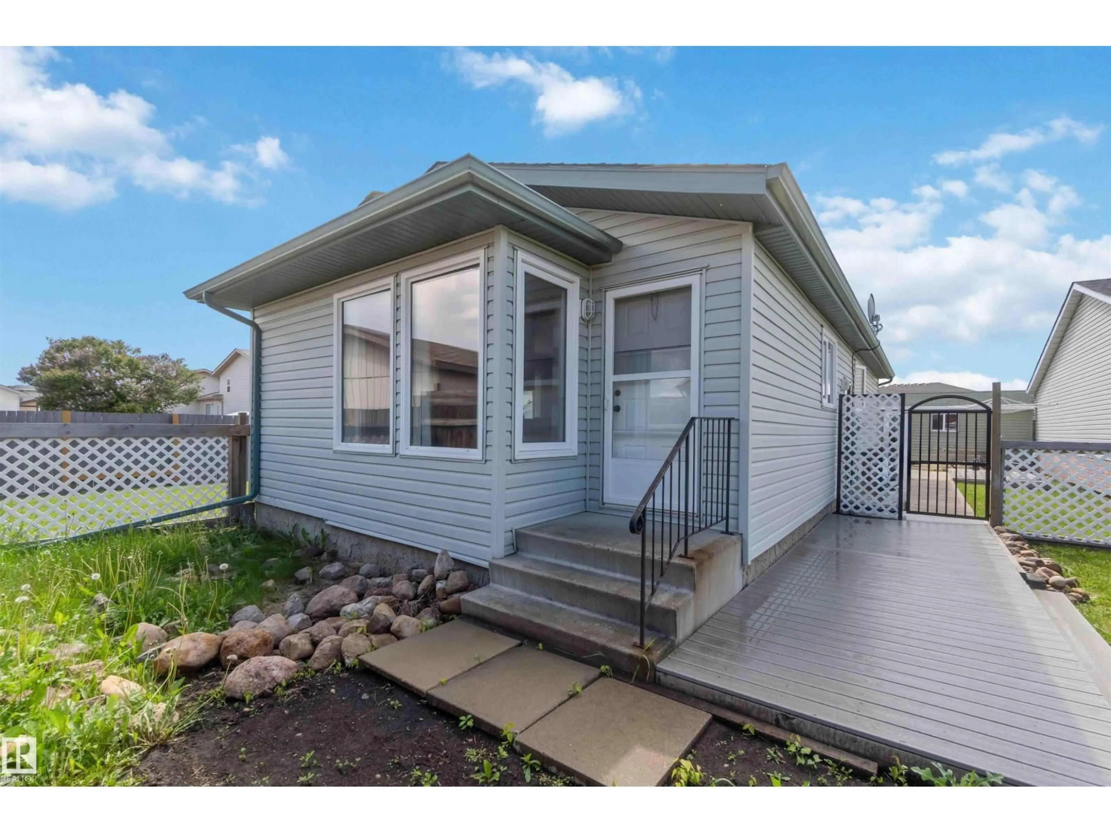 Home with vinyl exterior material, street for 143 BIRCH DR, Gibbons Alberta T0A1N0