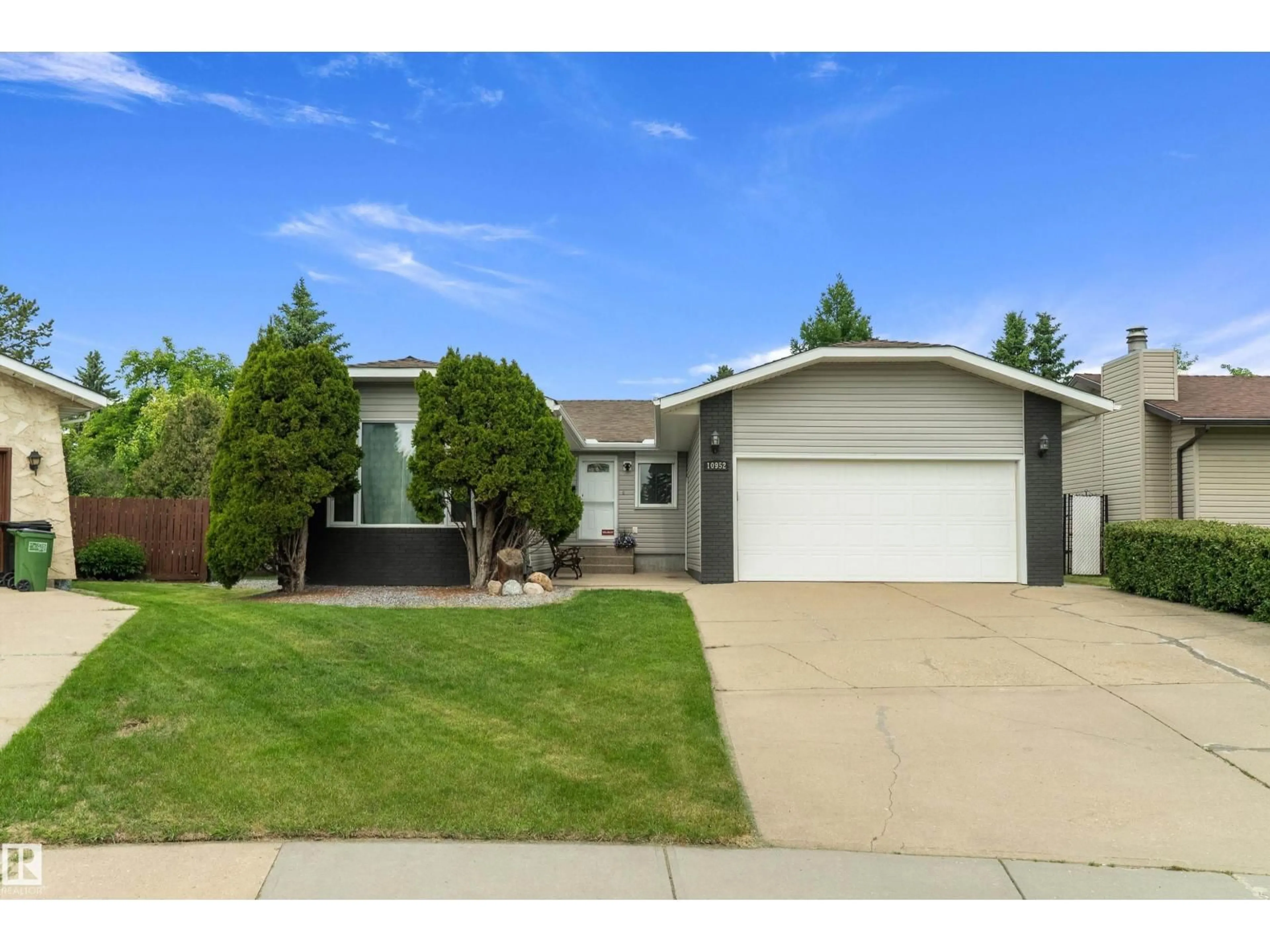 Home with vinyl exterior material, street for 10952 34A AV, Edmonton Alberta T6J2V1