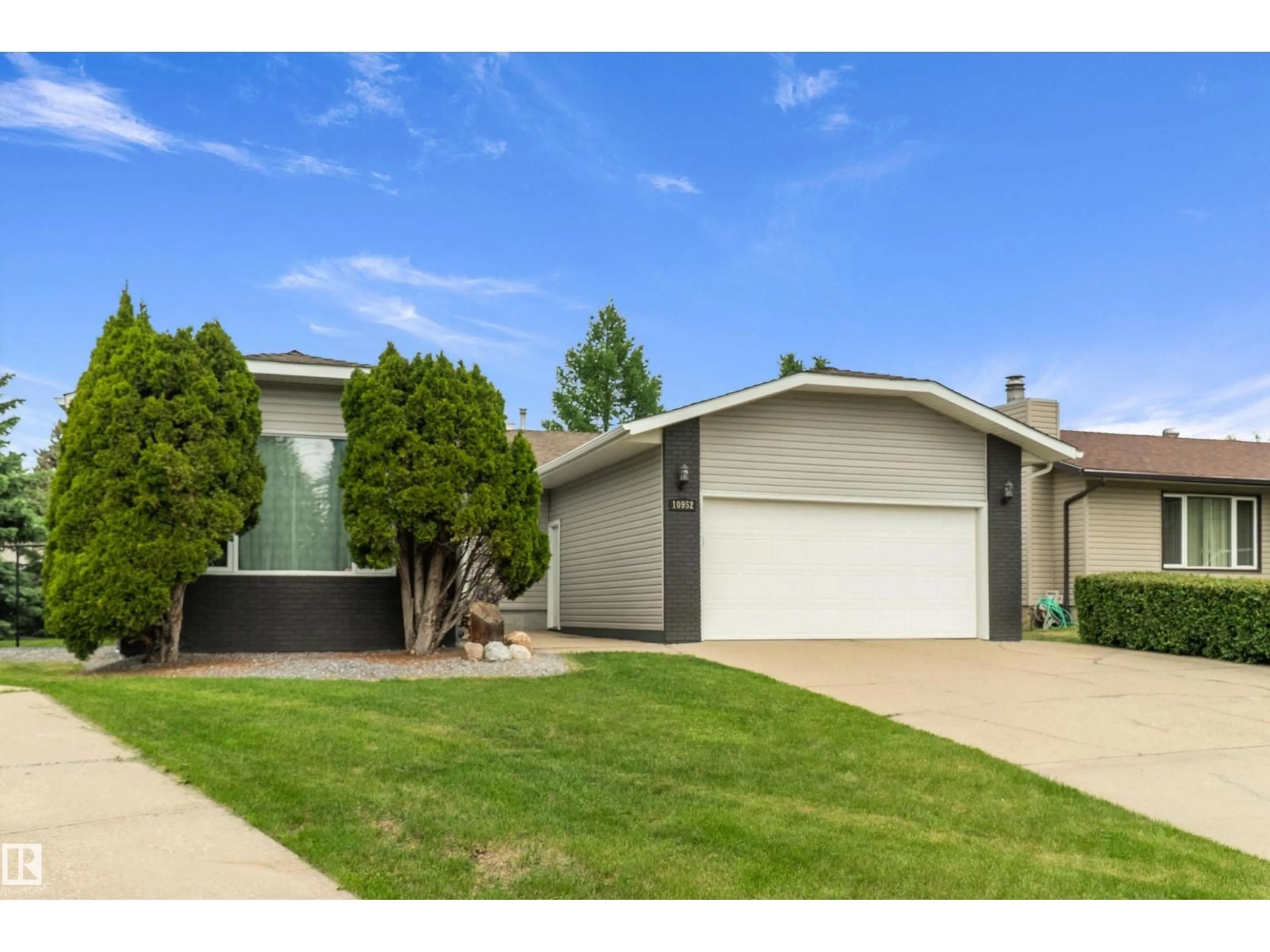 Home with vinyl exterior material, street for 10952 34A AV, Edmonton Alberta T6J2V1
