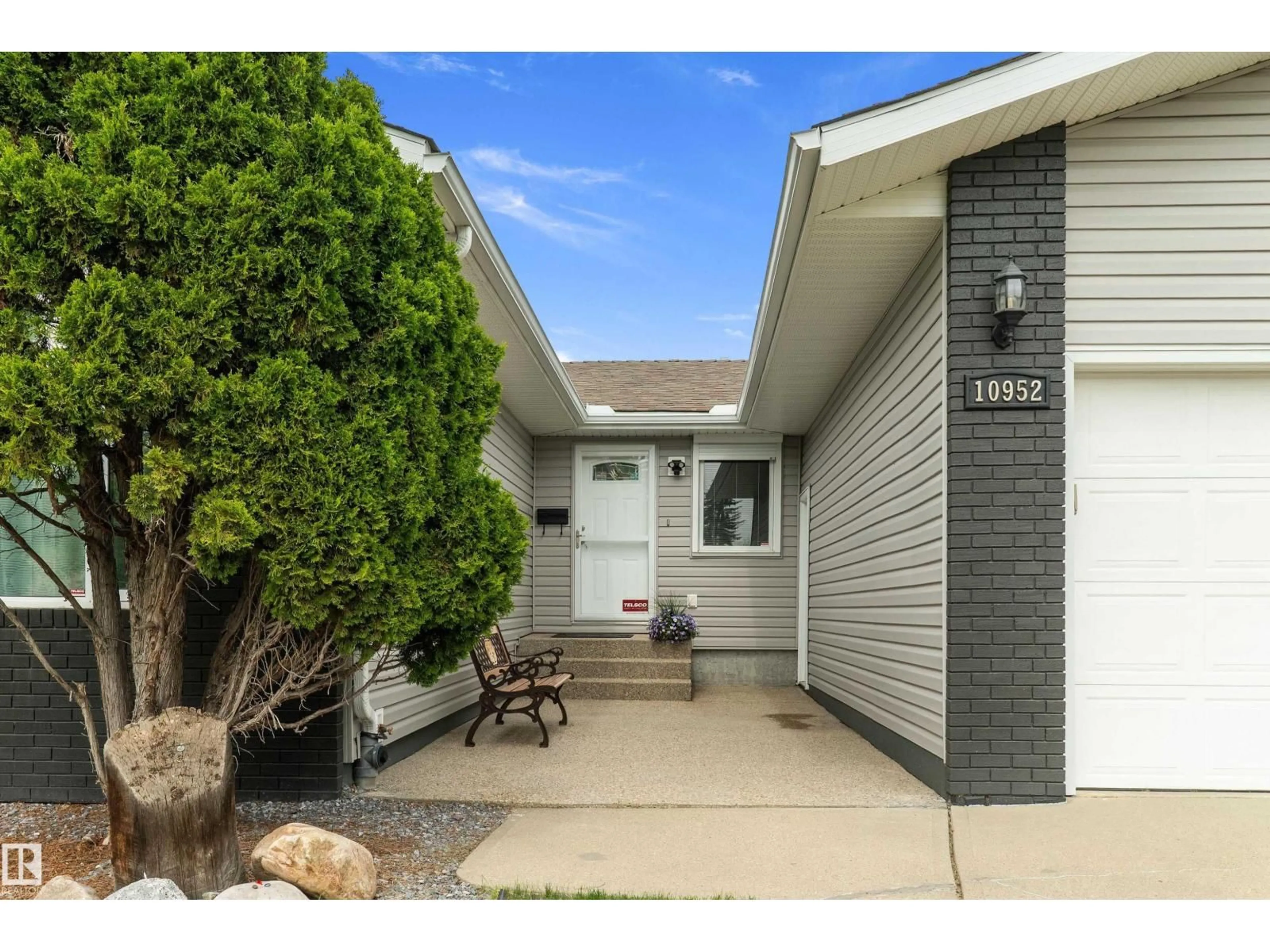 Home with vinyl exterior material, street for 10952 34A AV, Edmonton Alberta T6J2V1