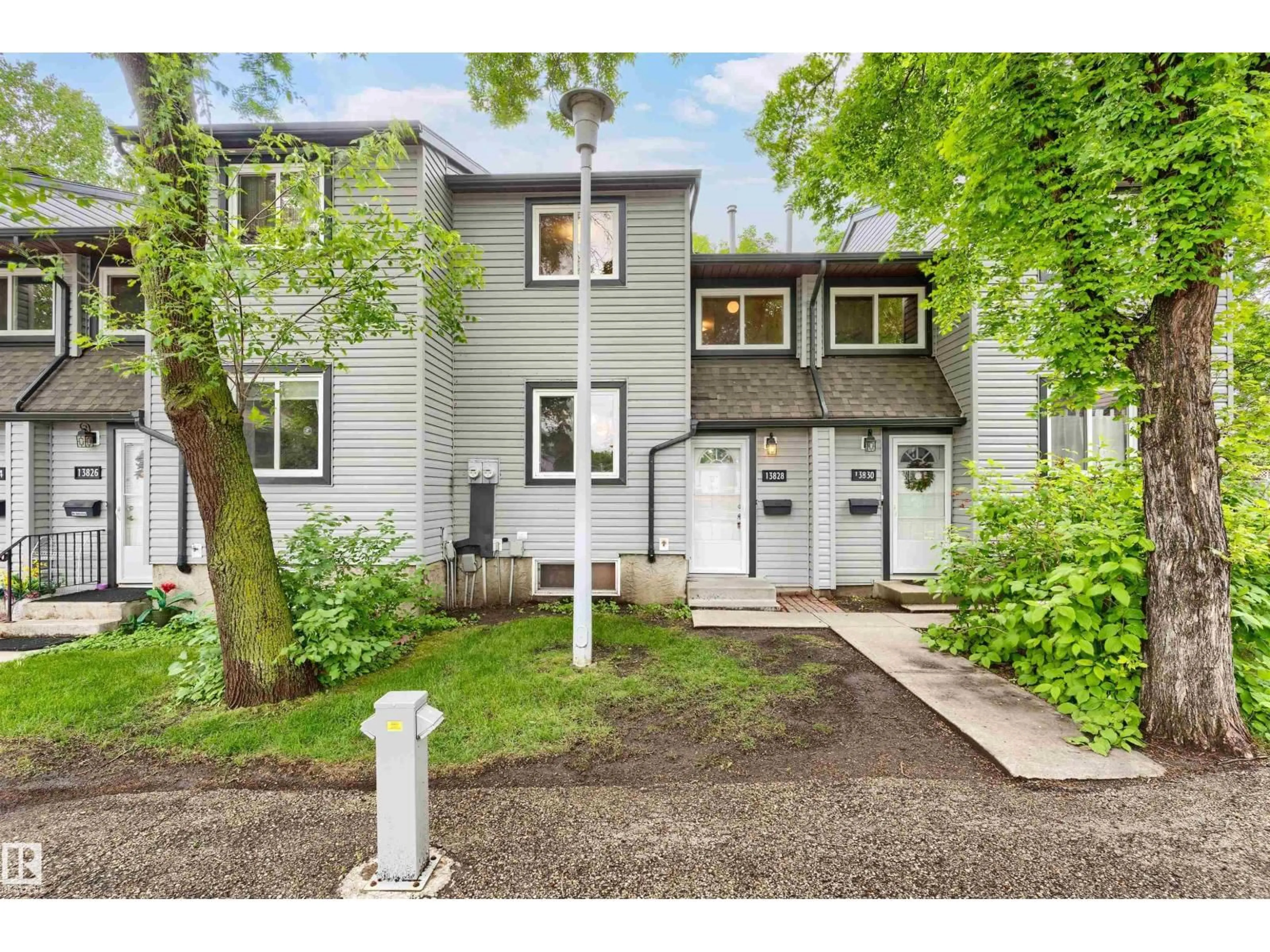 Home with vinyl exterior material, street for 13828 24 ST, Edmonton Alberta T5Y1B6