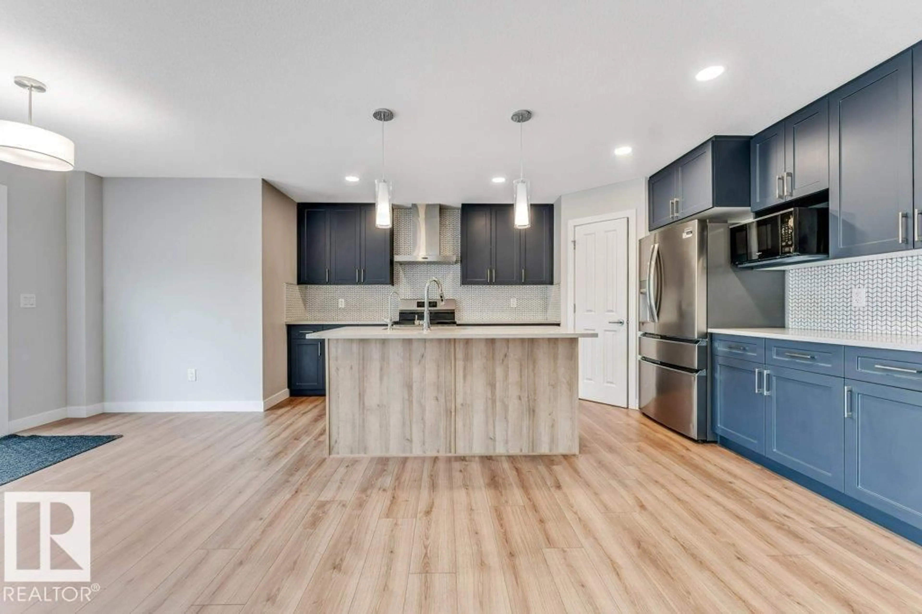 Open concept kitchen, wood/laminate floor for 403 35 AV, Edmonton Alberta T6T2P8