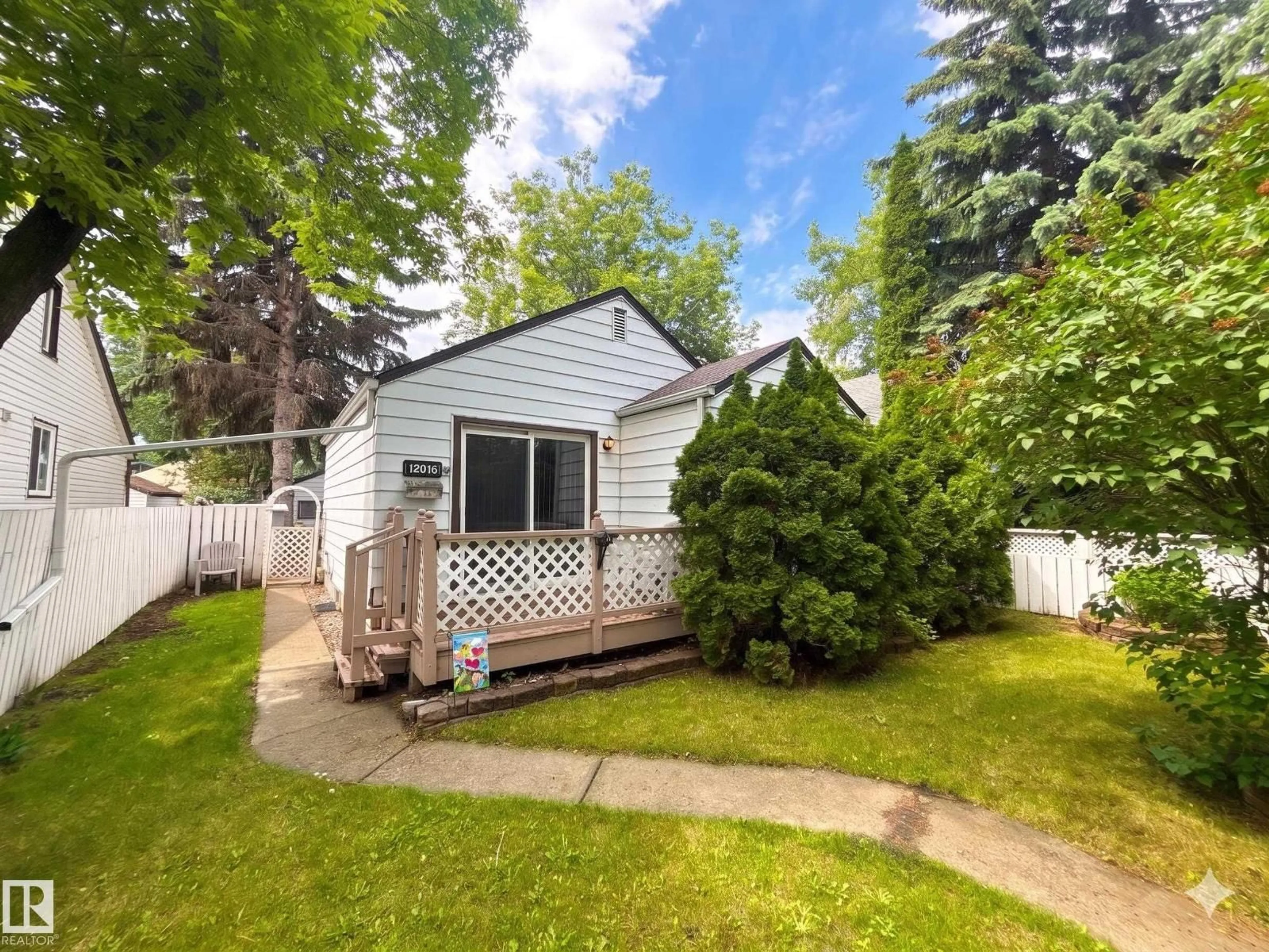 Home with vinyl exterior material, street for 12016 61 ST, Edmonton Alberta T5W4B1