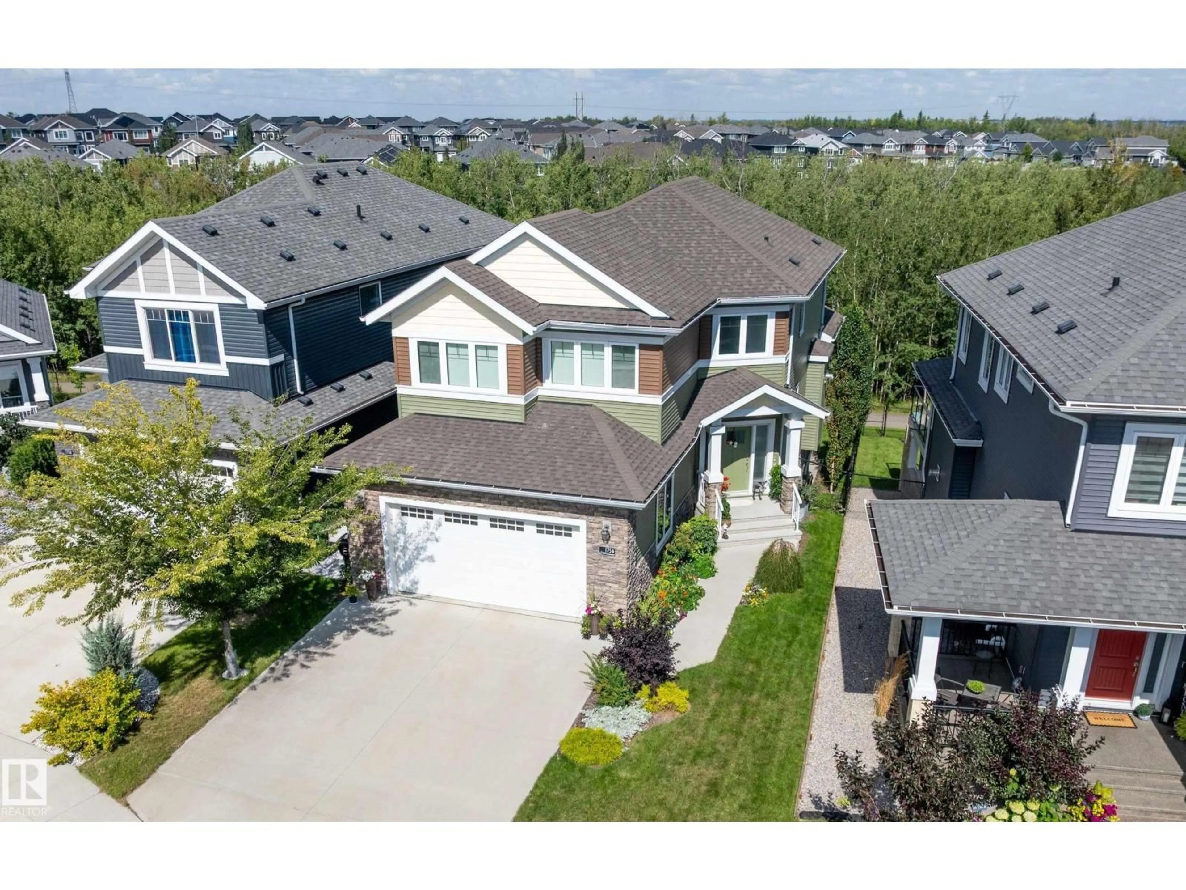 A pic from outside/outdoor area/front of a property/back of a property/a pic from drone, street for 1756 TANAGER CL, Edmonton Alberta T5S0N2