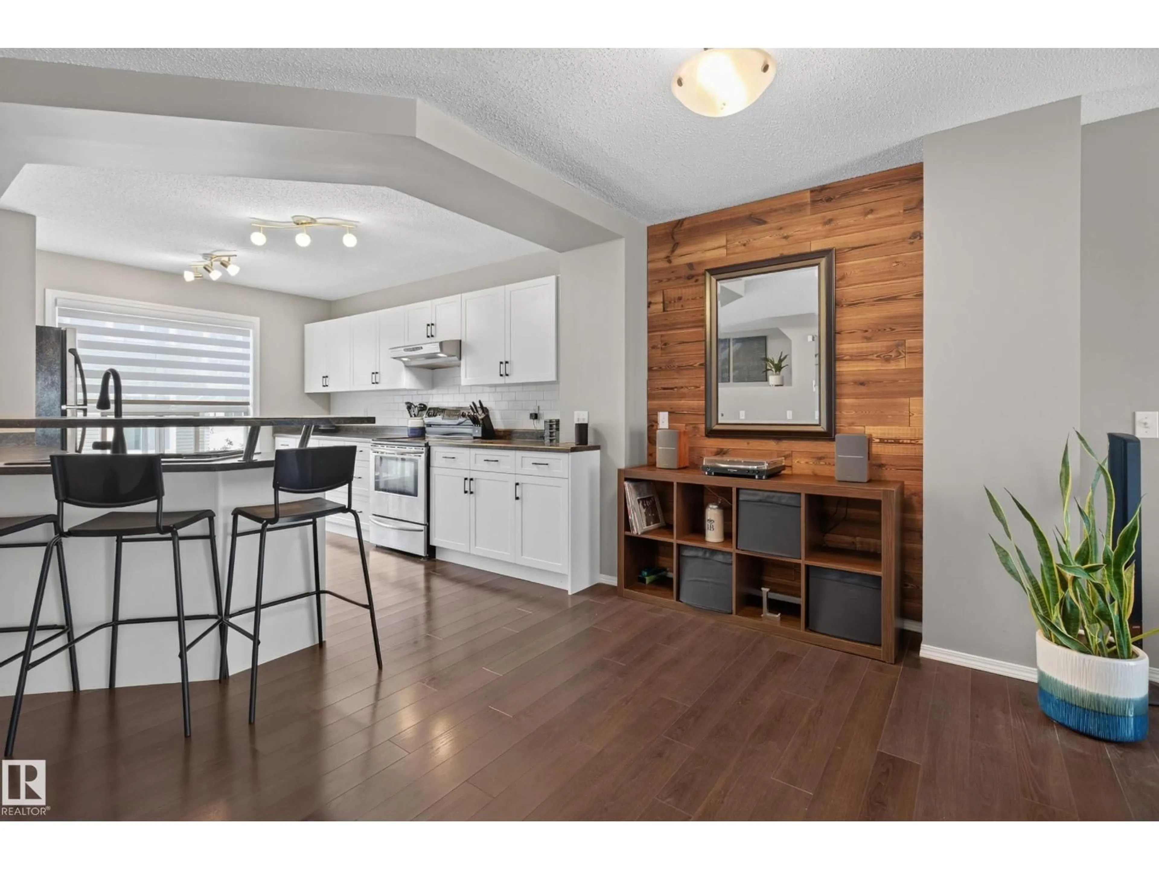 Open concept kitchen, wood/laminate floor for 17 - 5604 199 ST NW, Edmonton Alberta T6M2Z9