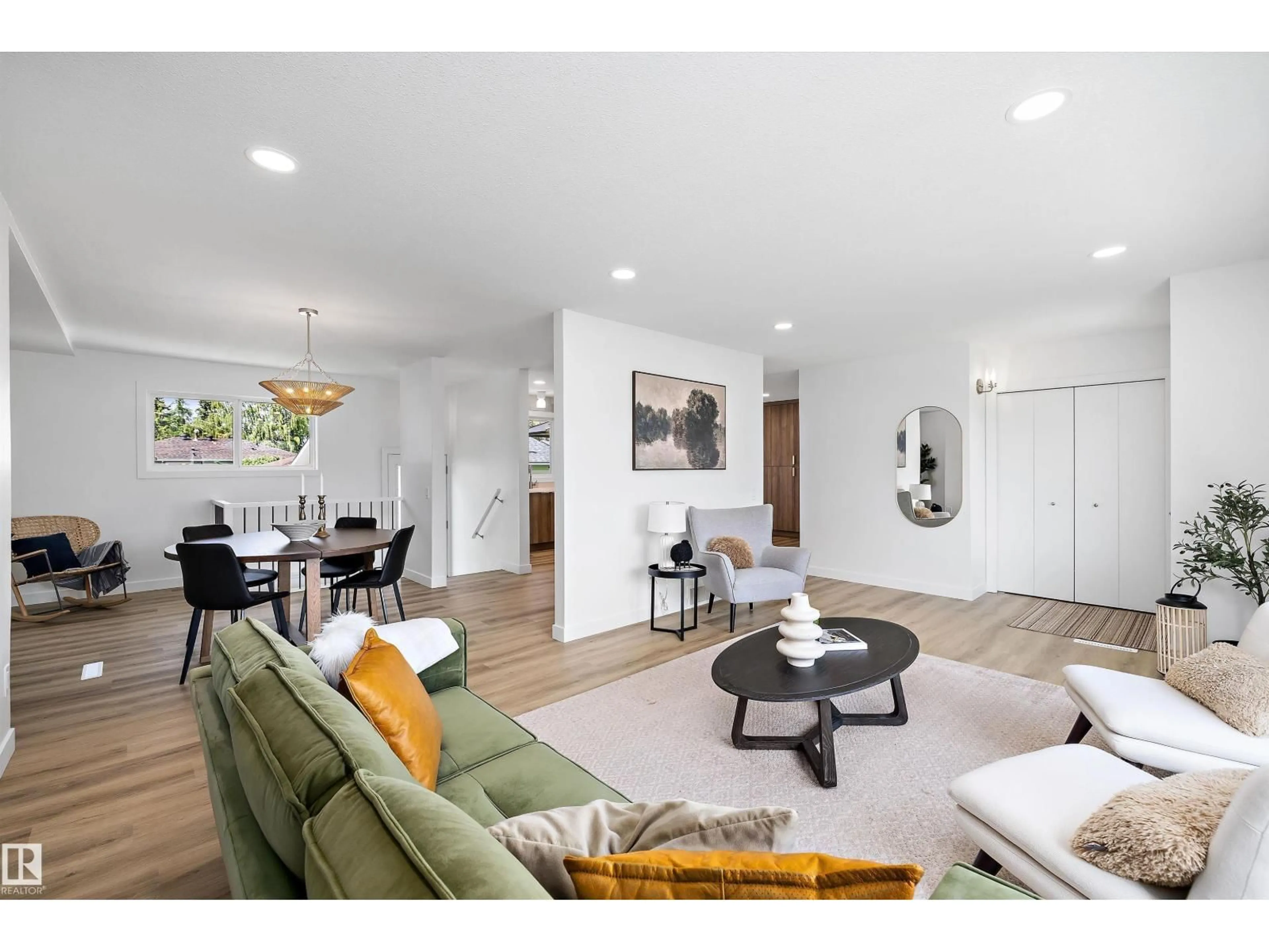 Living room with furniture, wood/laminate floor for 7004 93 AV, Edmonton Alberta T6B0W6