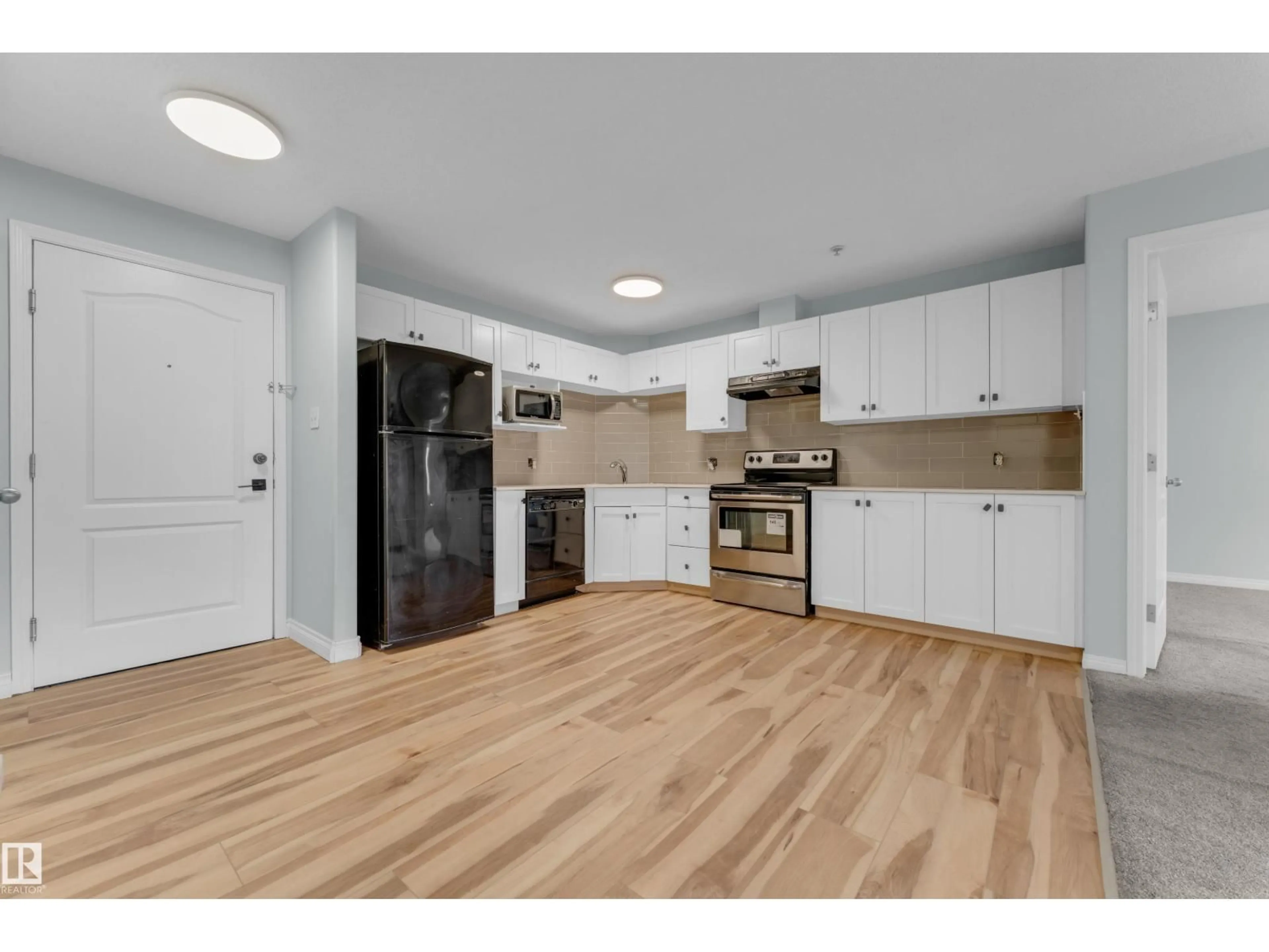 Open concept kitchen, wood/laminate floor for 111 - 326 EDWARDS DR, Edmonton Alberta T6X0C4