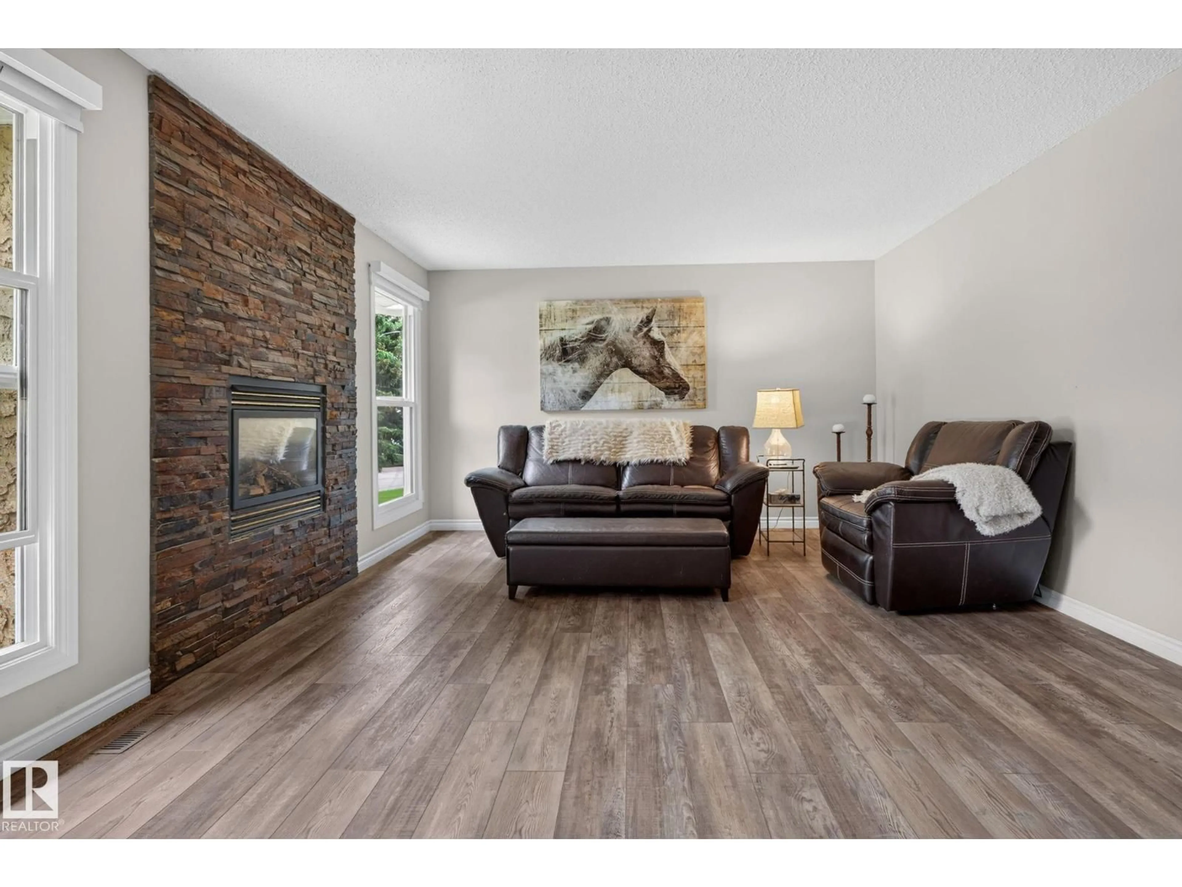 Living room with furniture, wood/laminate floor for 5240 56A ST, Beaumont Alberta T4X1B4