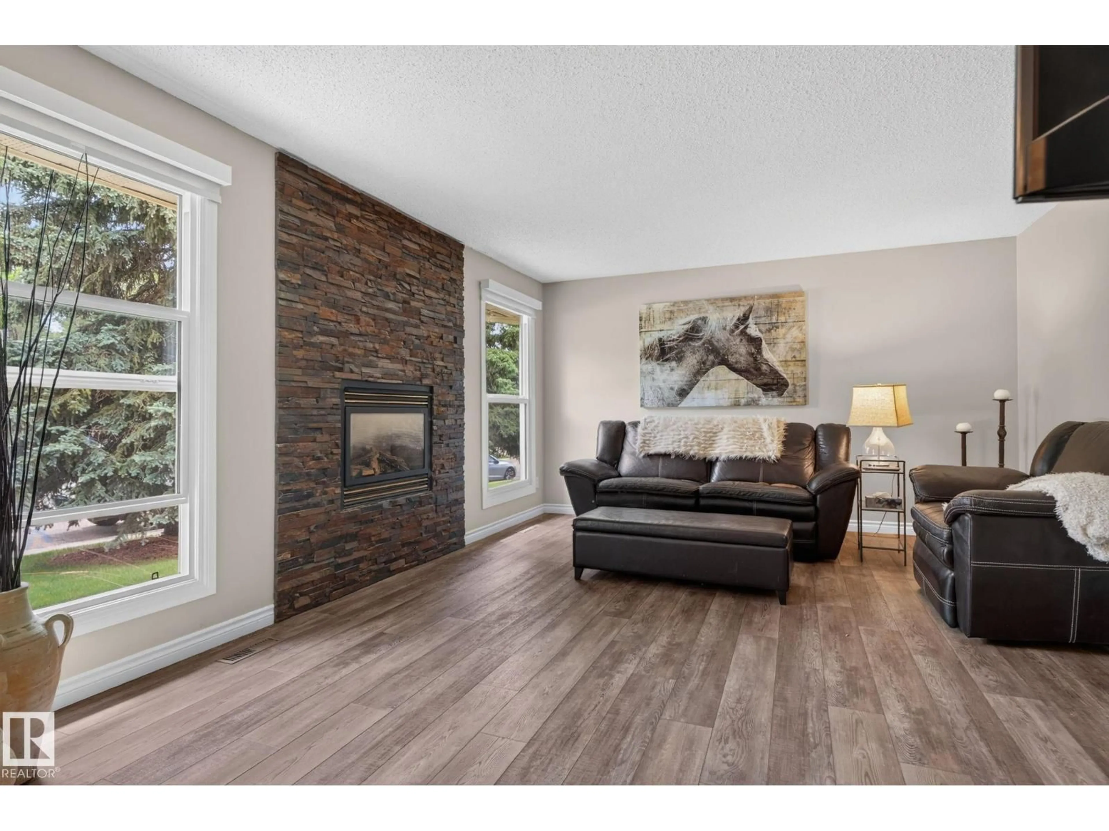 Living room with furniture, wood/laminate floor for 5240 56A ST, Beaumont Alberta T4X1B4