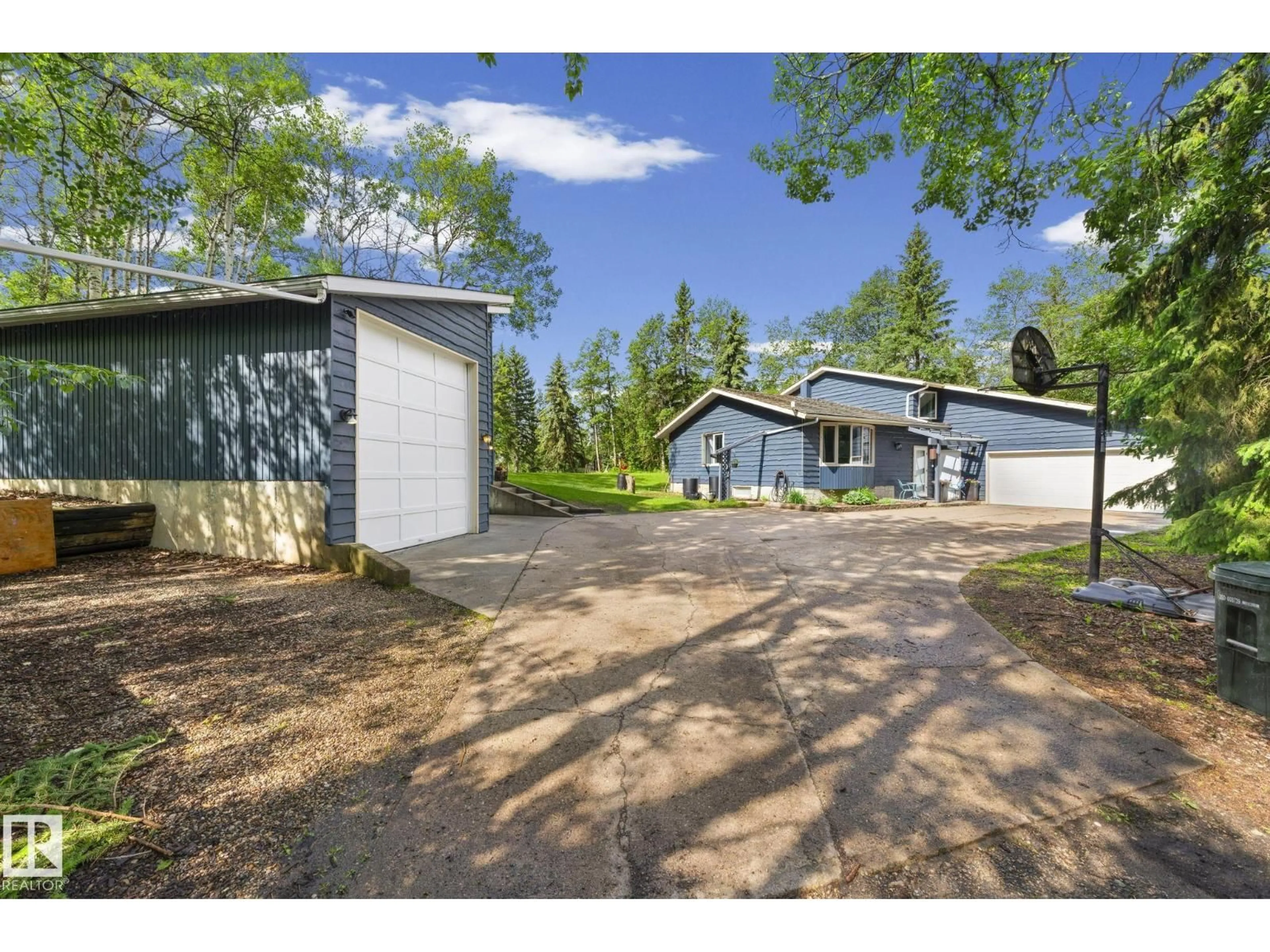 A pic from outside/outdoor area/front of a property/back of a property/a pic from drone, street for 265 TWP ROAD 530, Rural Strathcona County Alberta T8E2C5
