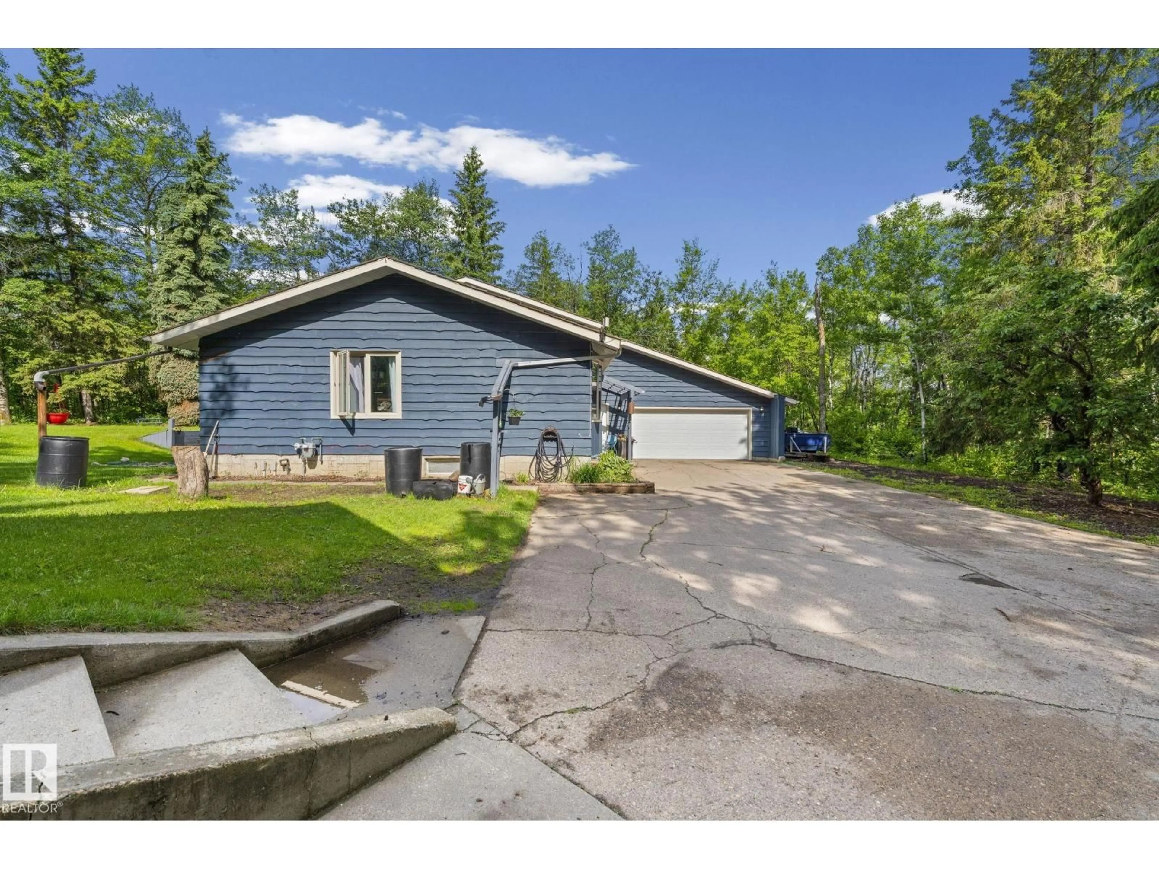 A pic from outside/outdoor area/front of a property/back of a property/a pic from drone, street for 265 TWP ROAD 530, Rural Strathcona County Alberta T8E2C5