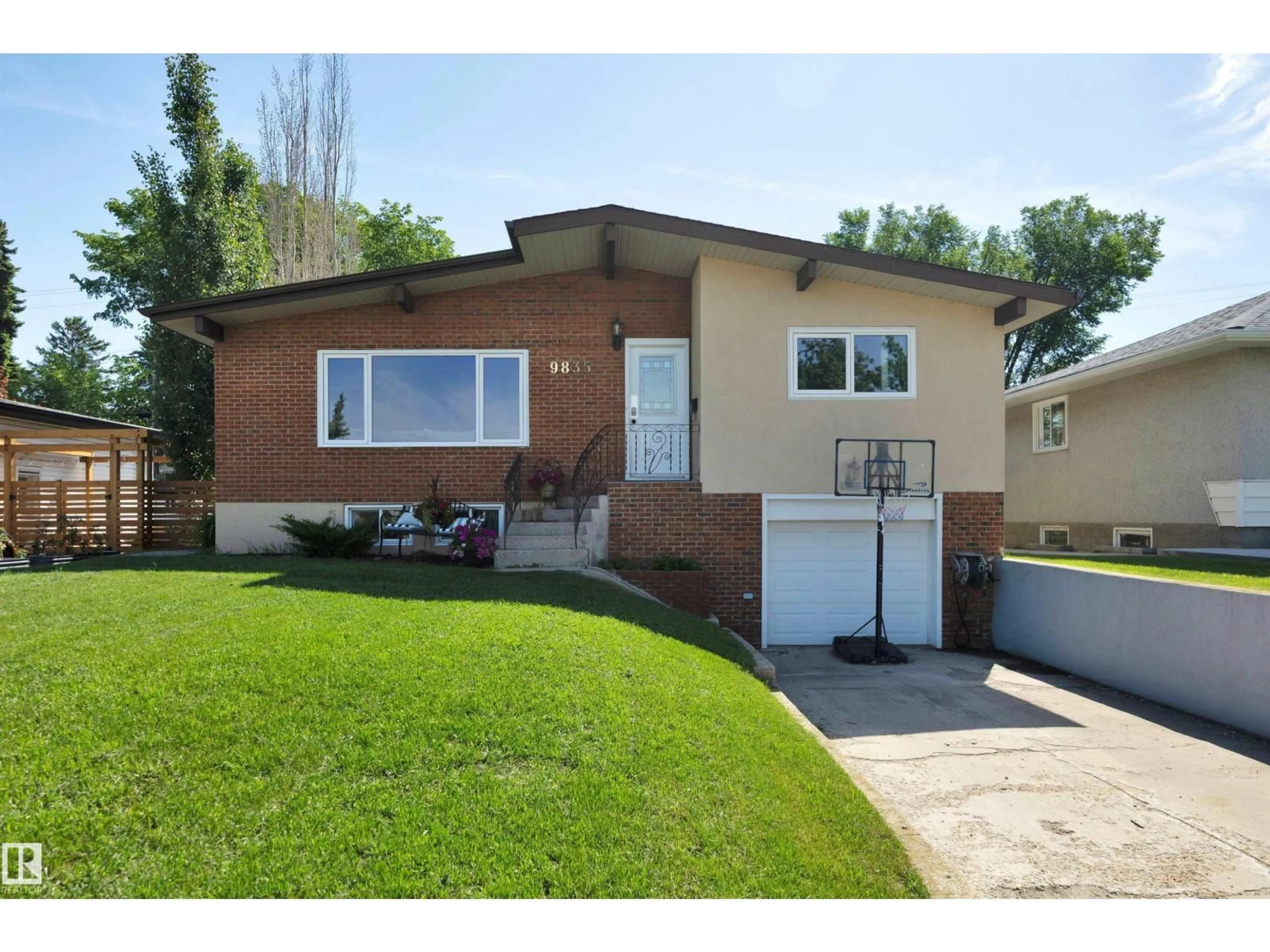 Home with vinyl exterior material, street for 9835 74 ST, Edmonton Alberta T6A2X6