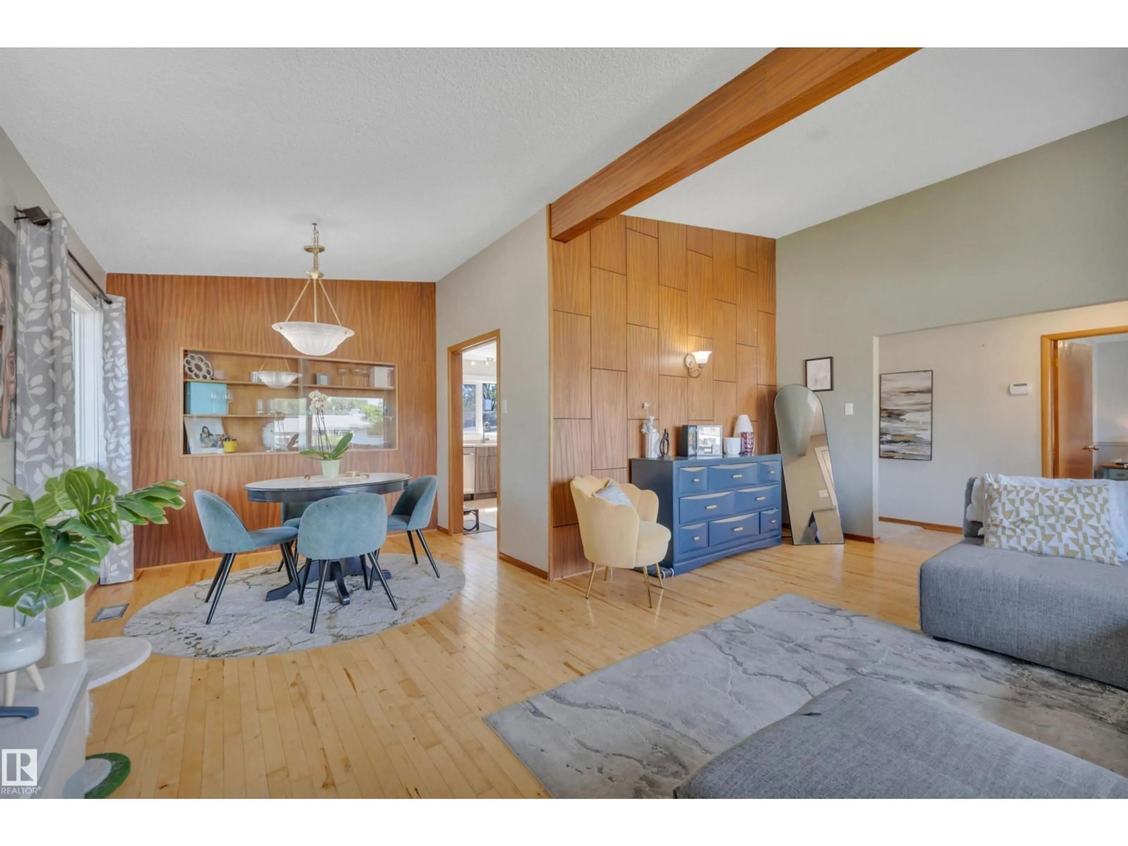 Living room with furniture, wood/laminate floor for 9835 74 ST, Edmonton Alberta T6A2X6