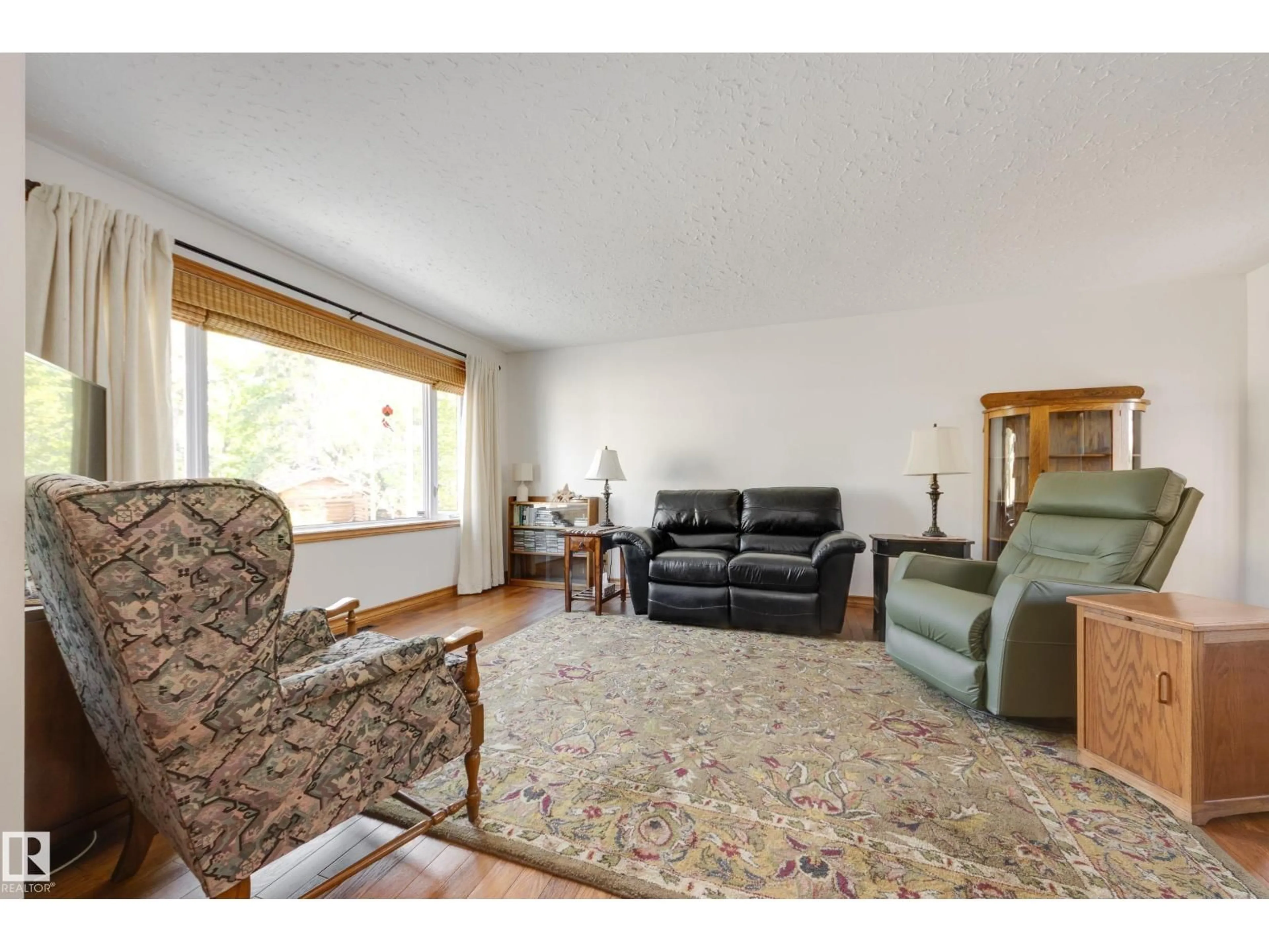 Living room with furniture, unknown for 7216 103 AV, Edmonton Alberta T6A0V1