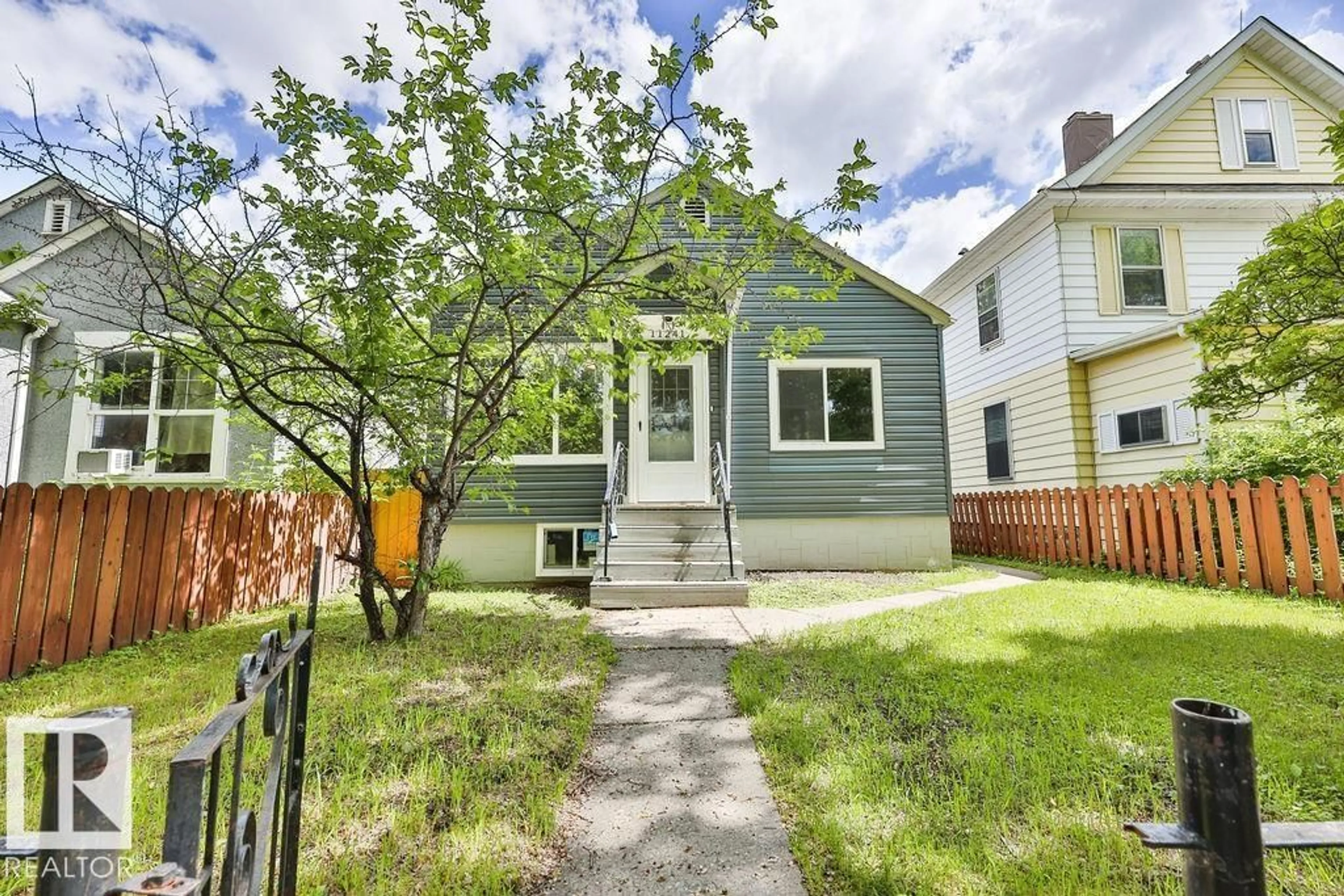 Home with vinyl exterior material, street for 11241 88 ST, Edmonton Alberta T5B3P6