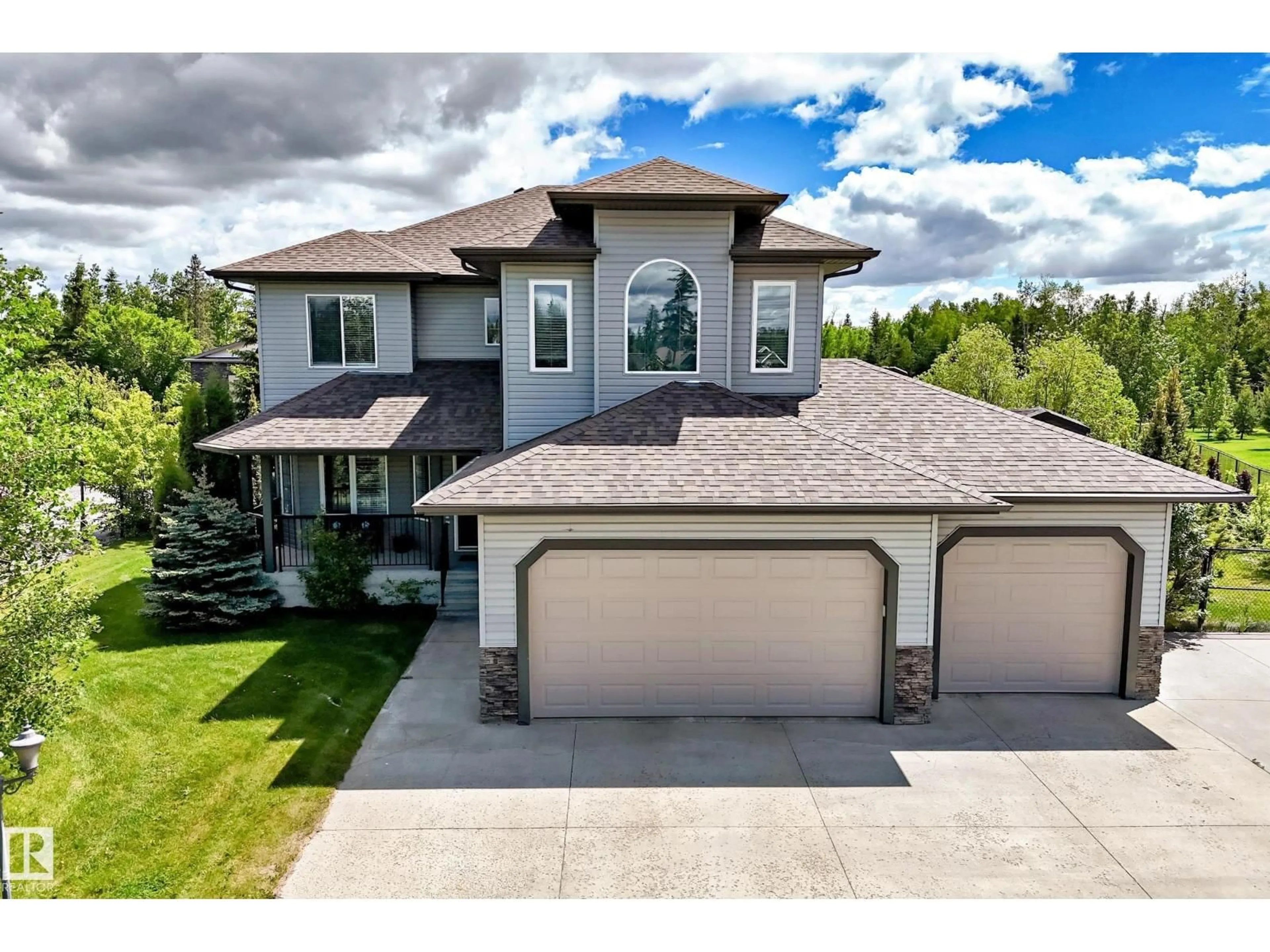 A pic from outside/outdoor area/front of a property/back of a property/a pic from drone, street for 59 53305 RGE ROAD 273, Rural Parkland County Alberta T7X3K2
